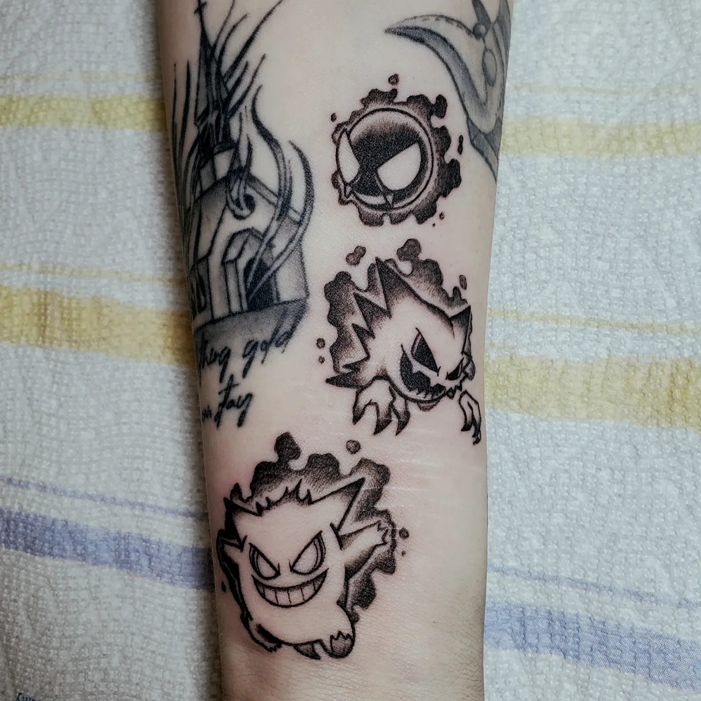Ghosts black and grey tattoo on the forearm by Shailey Pasquale