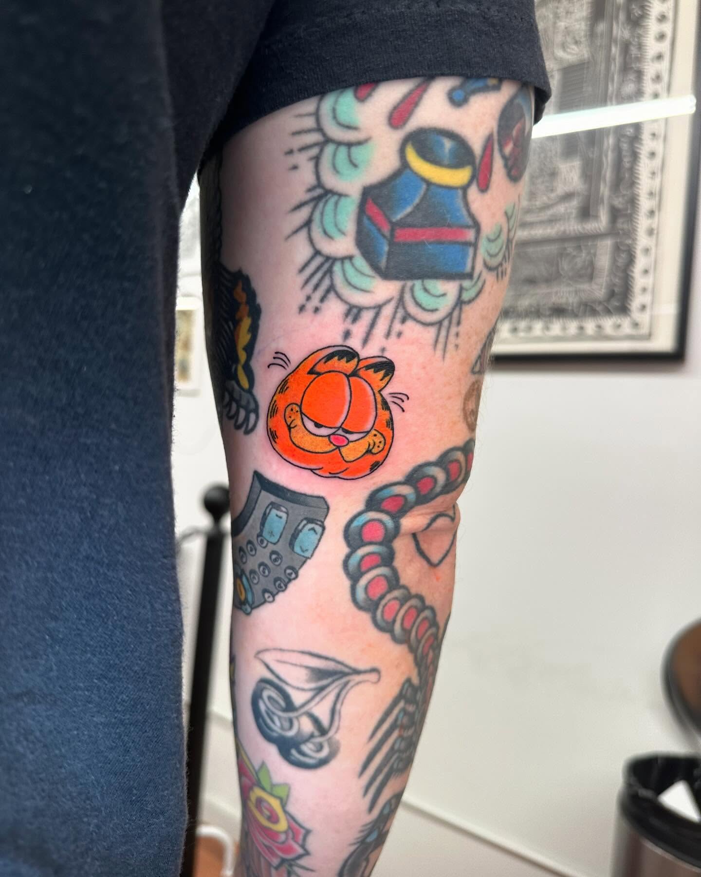 Garfield American traditional tattoo on the forearm by ⠀Joey Rosado