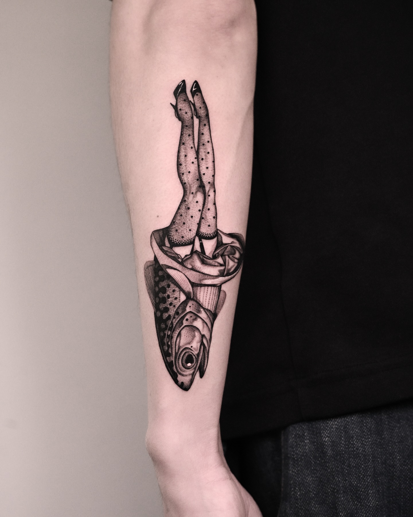 Legs in fish dotwork tattoo on the forearm by 9rukim