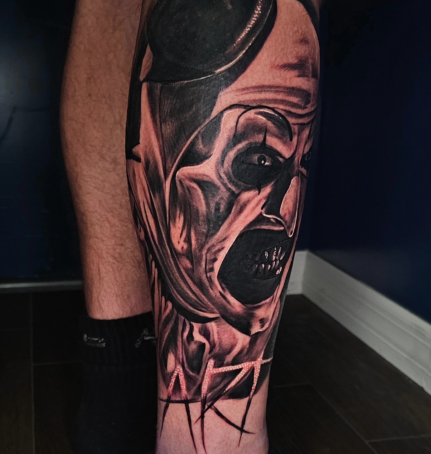 Clown realism tattoo on the forearm by Christian Mulvey