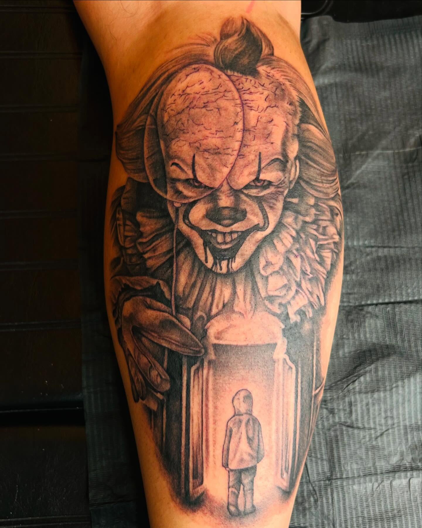 Clown and child realism tattoo on the thigh by Taylor Steckman