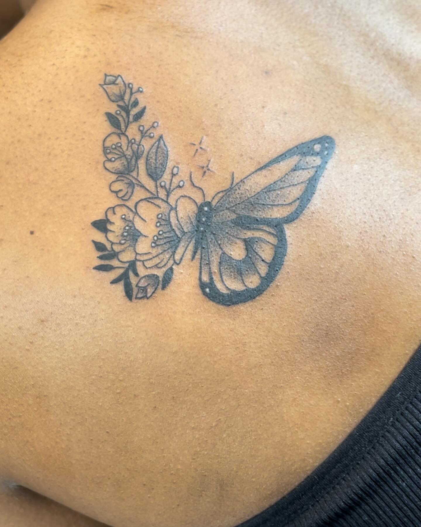 Butterfly and flowers black and grey tattoo on the back by Real Smuve