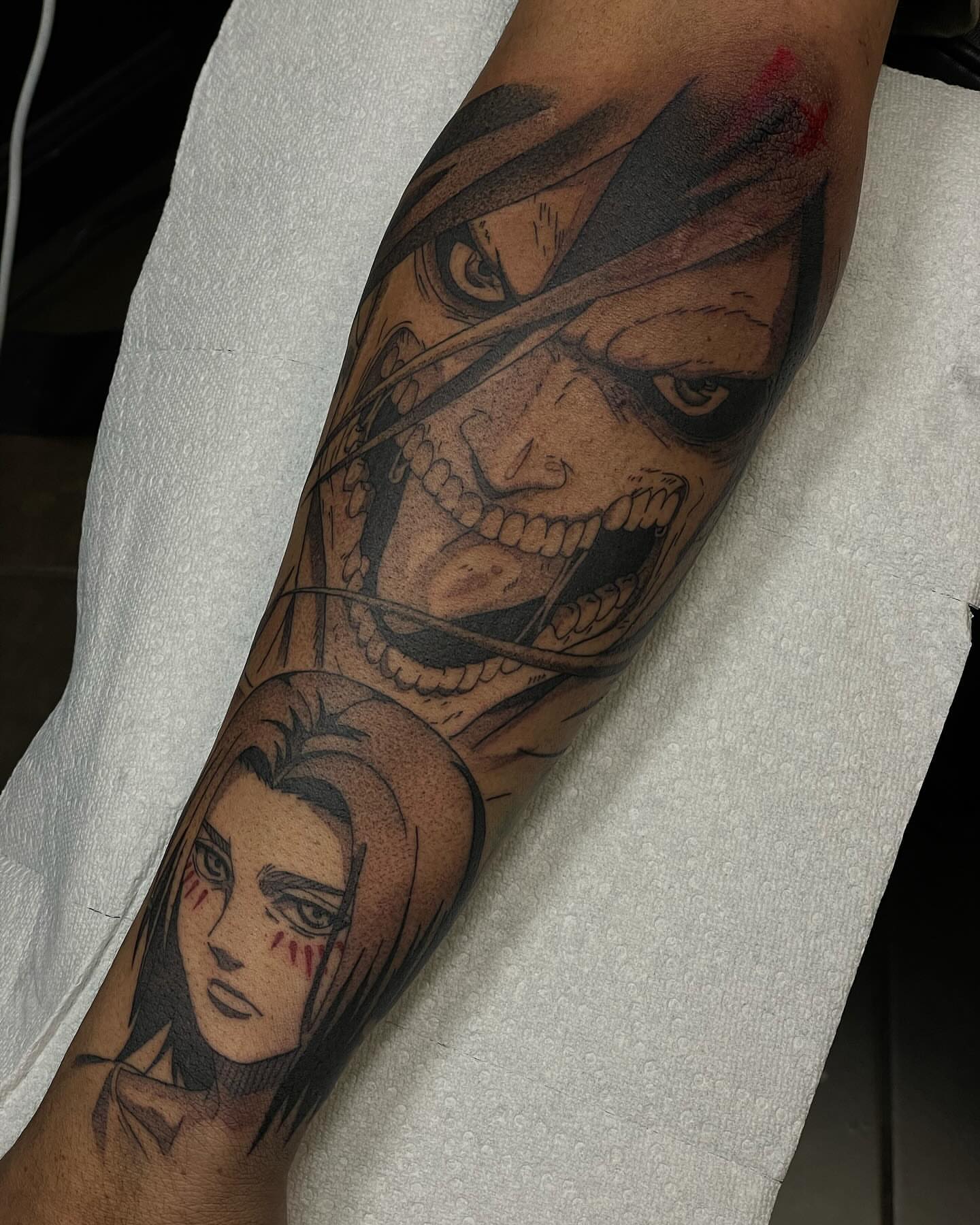 Anime characters anime tattoo on the forearm by Jesse (Dreadzilla)