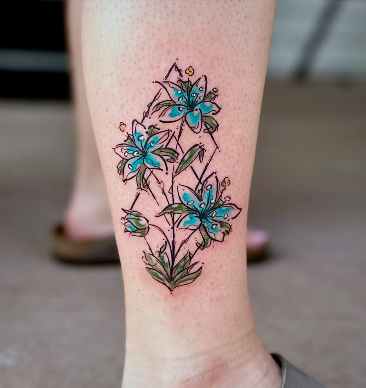 Blue lilies dotwork tattoo on the calf by manda, Lebanon, Ohio