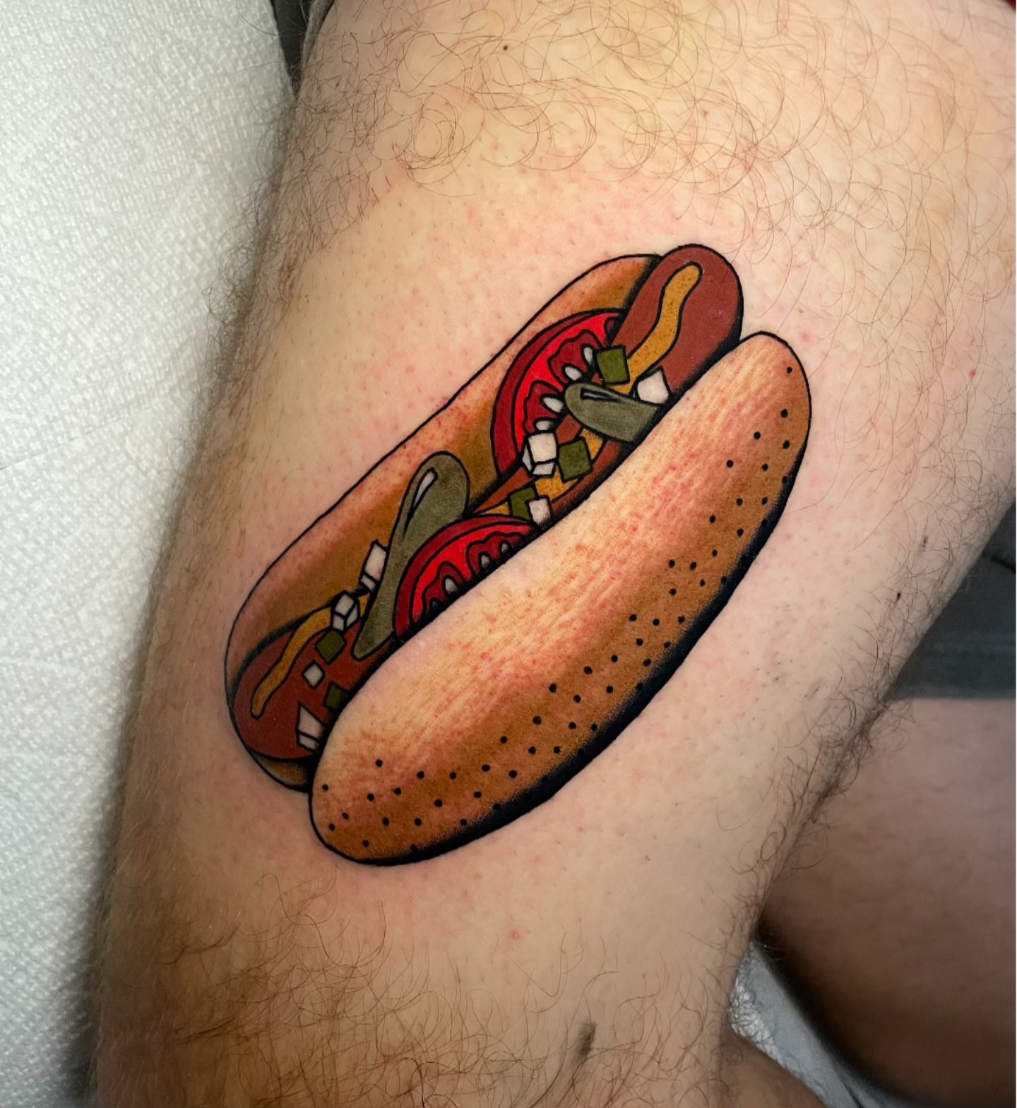 Hot dog dotwork tattoo on the thigh by Toulouse Noble, Portland, Oregon