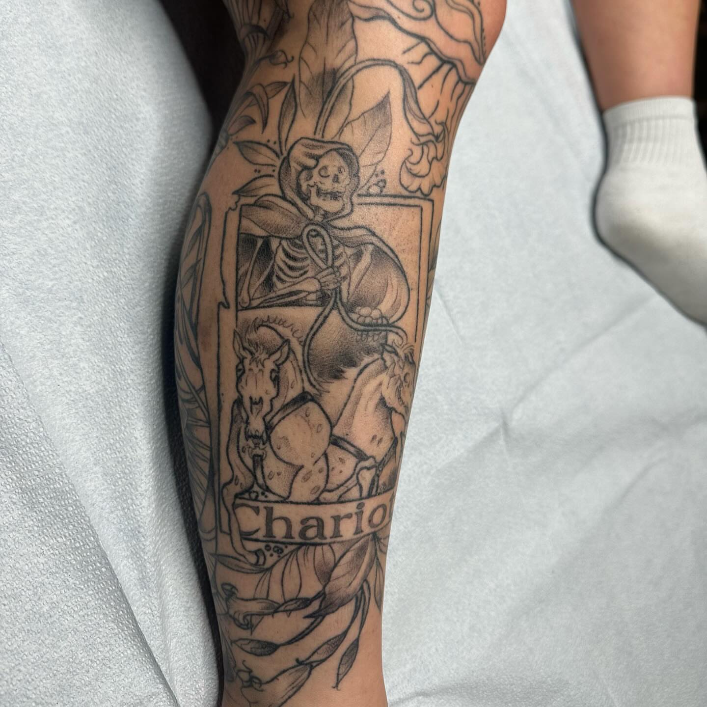 Chariot black and grey tattoo on the forearm by Halle Haas