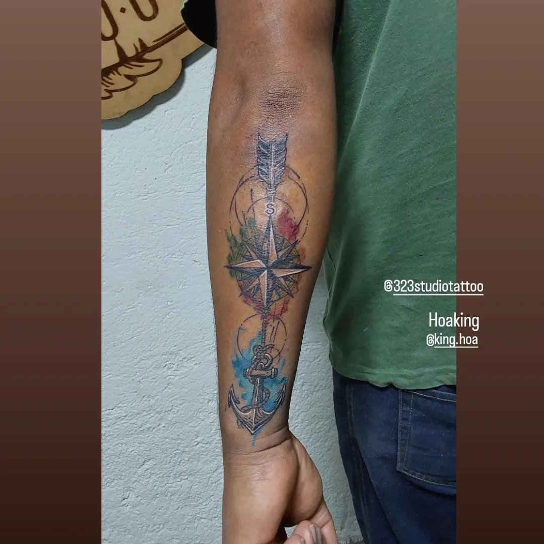 Compass and anchor geometric tattoo on the forearm by Hoa King