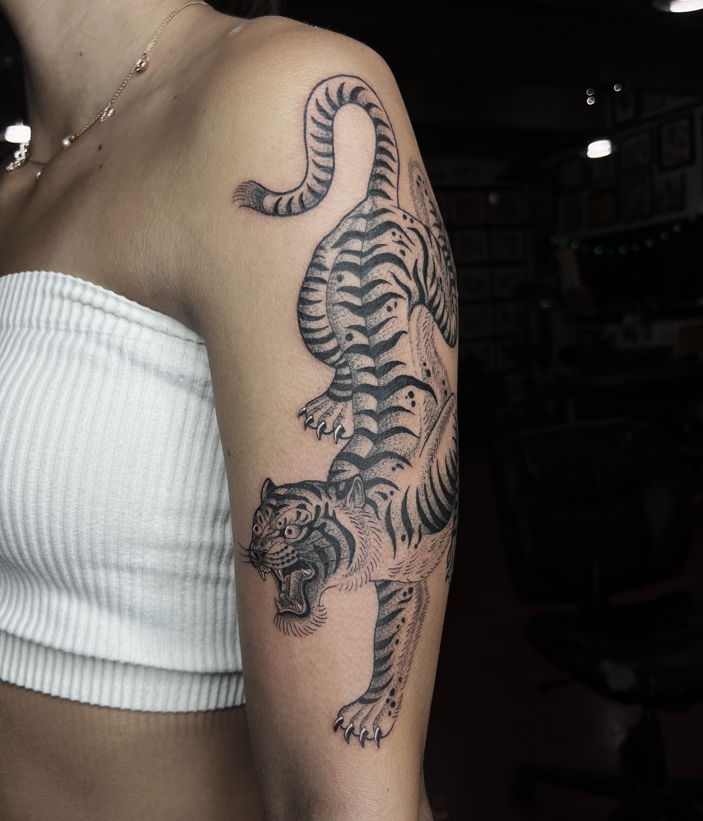 Tiger dotwork tattoo on the forearm by Taylor Newton