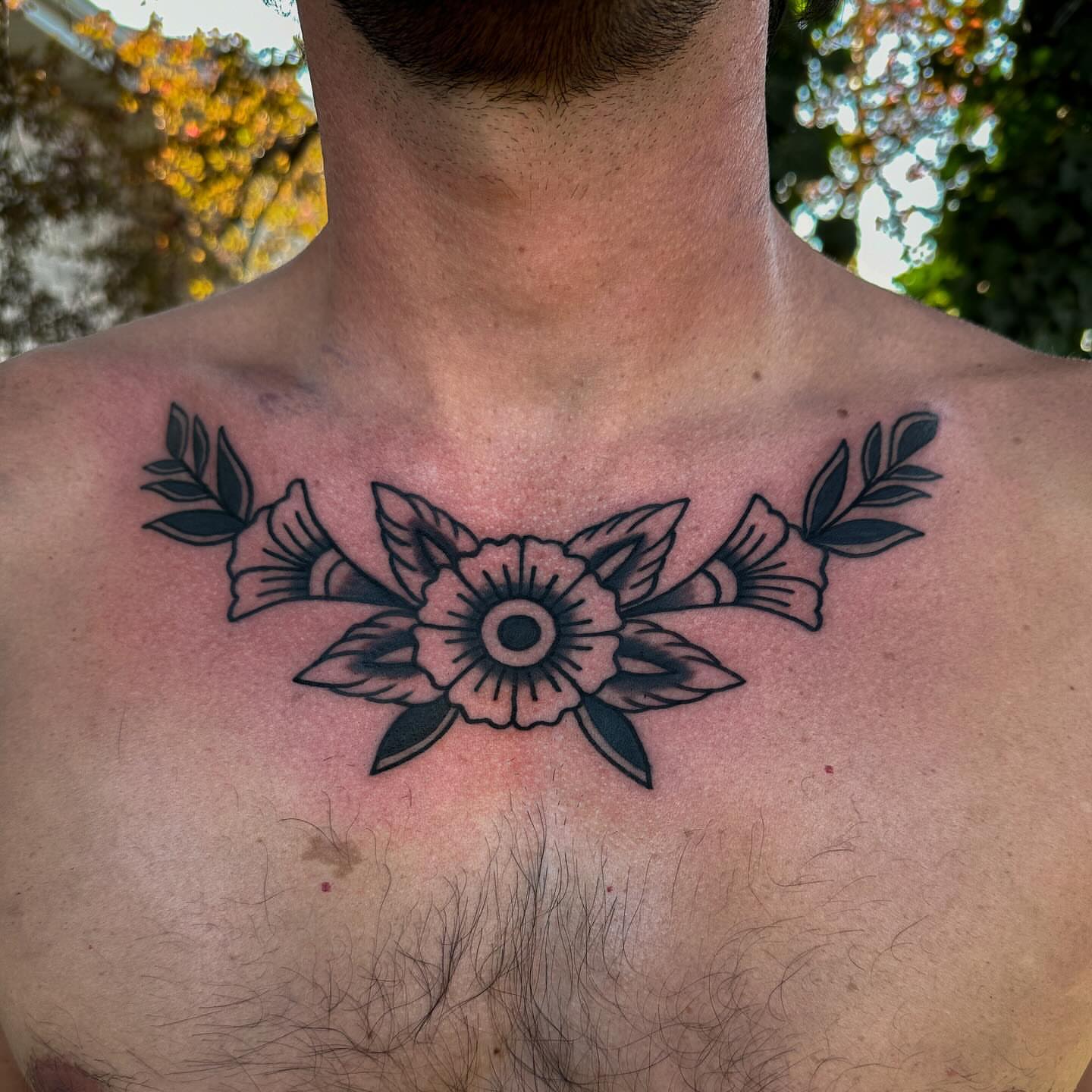 Flower black and grey tattoo on the chest by Gabby Tolley🌛
