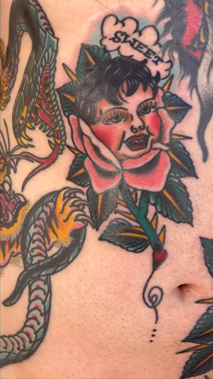 Woman and snake American traditional tattoo by Kayle Leogrande