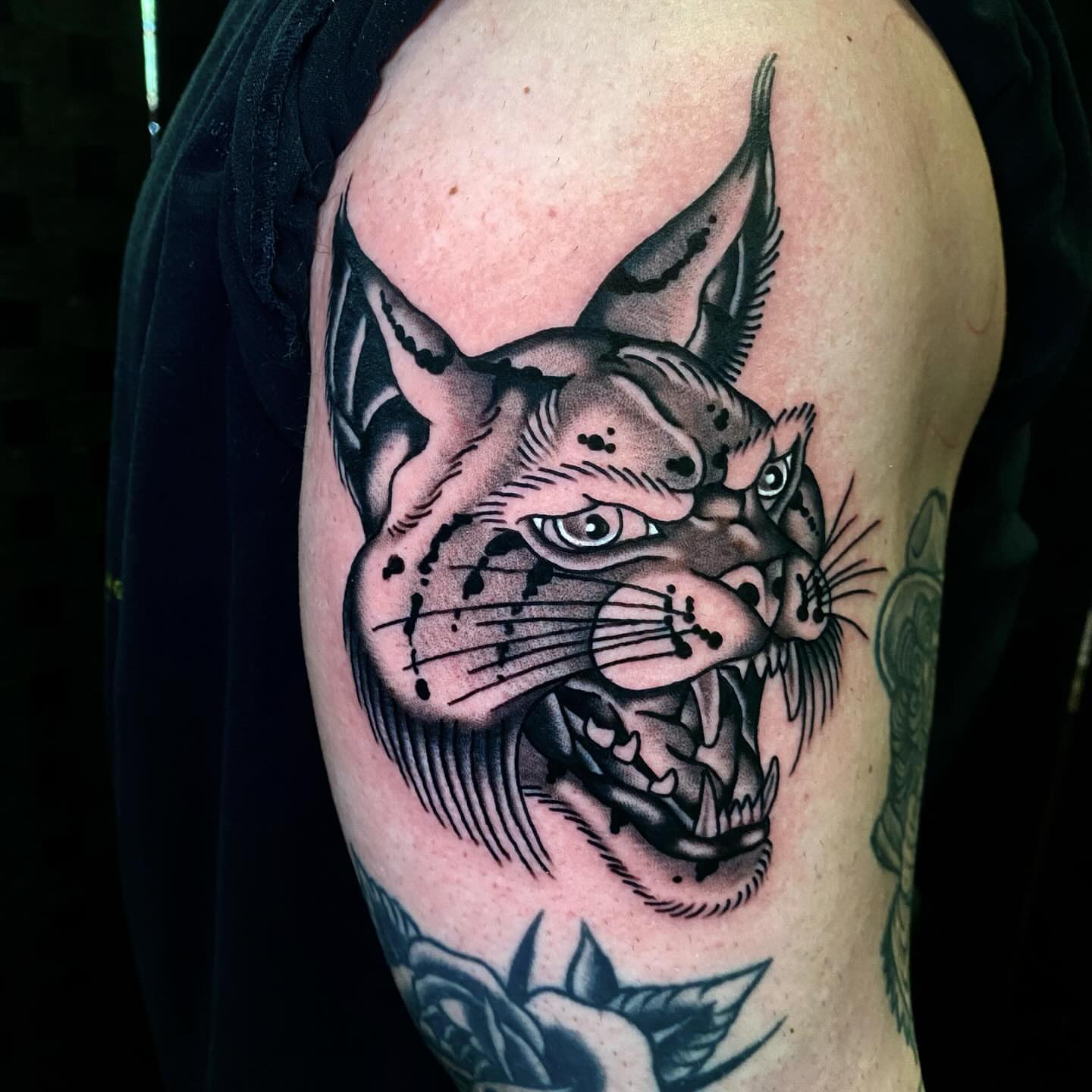 Panther black and grey tattoo on the shoulder by Justin R. Mitchell, Fort Worth, Texas