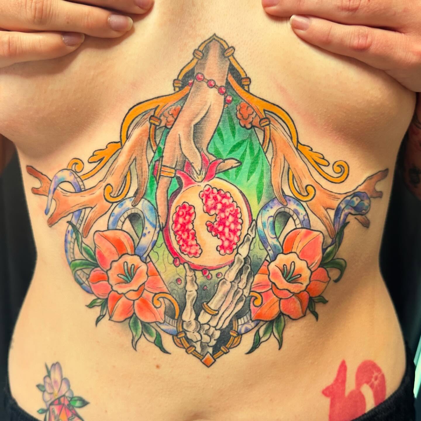 Pomegranate and flowers new school tattoo on the ribs by Halle Haas