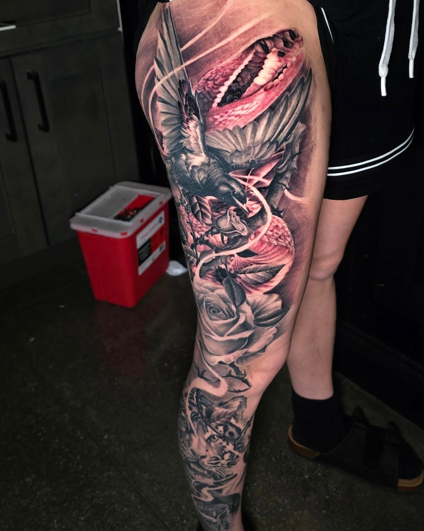 Dragon and roses realism tattoo on the forearm by Myth & Mercy Tattoo Co.