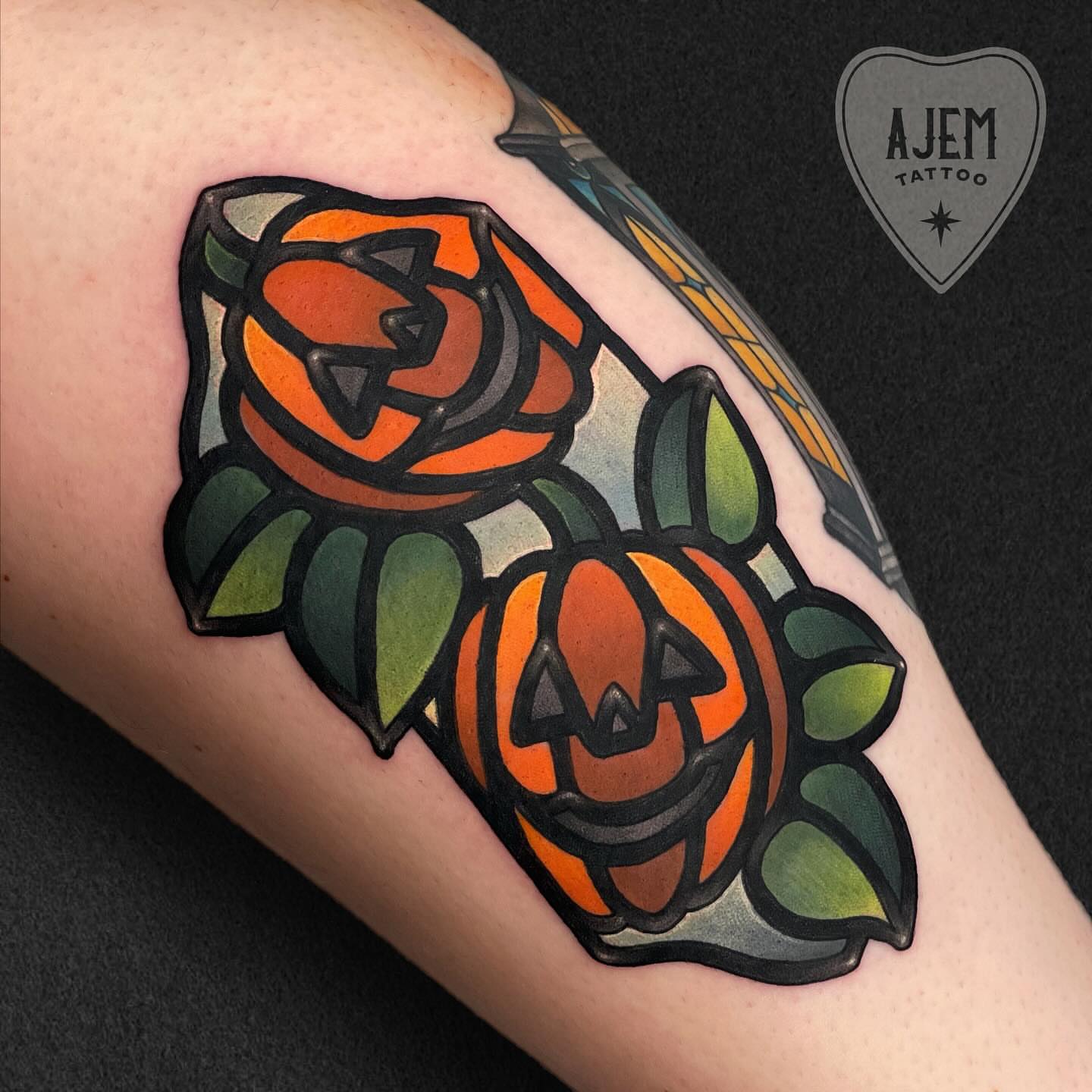 Pumpkin and rose American traditional tattoo on the forearm by Ash MacIsaac