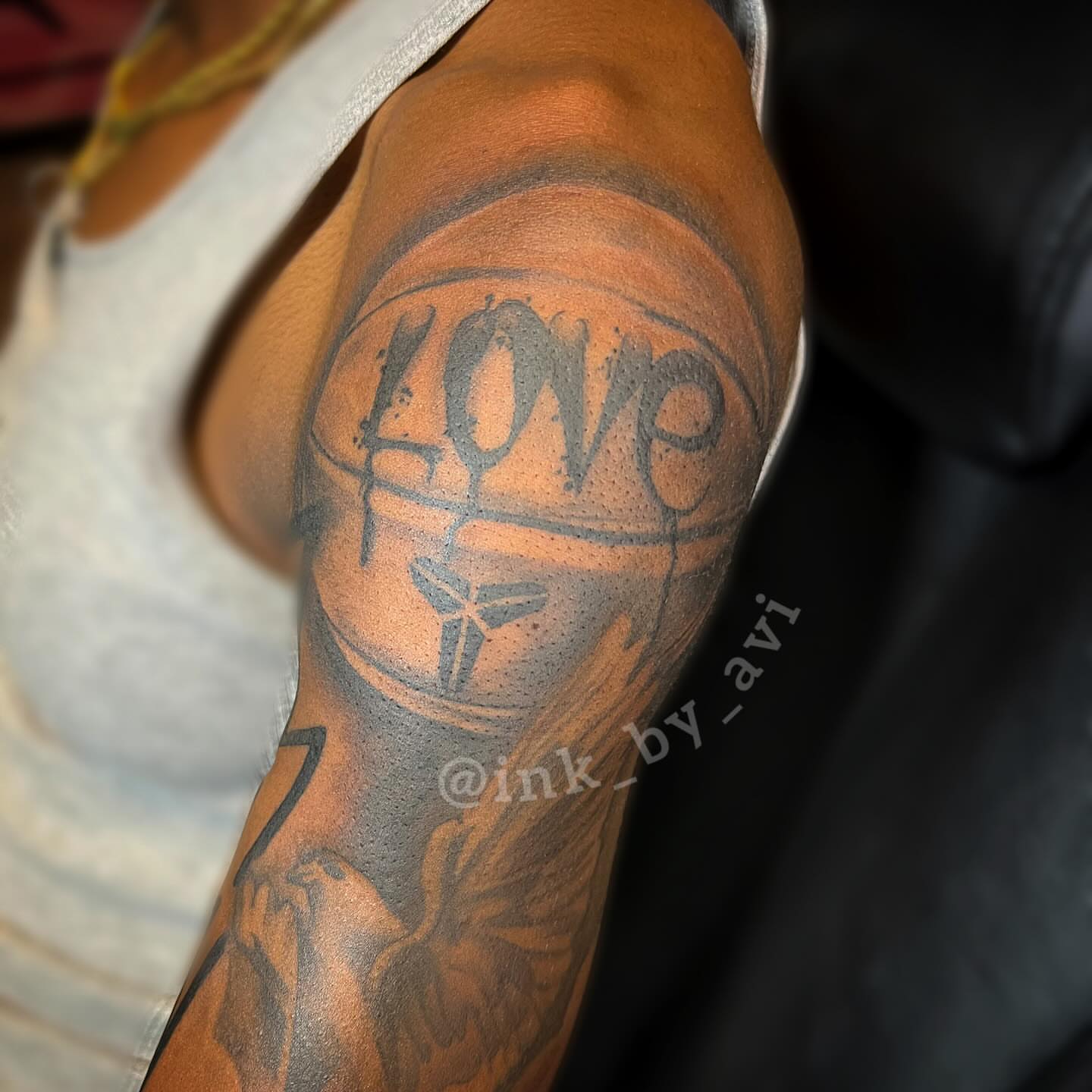 Love black and grey tattoo on the forearm by Avi, Cleveland, Ohio