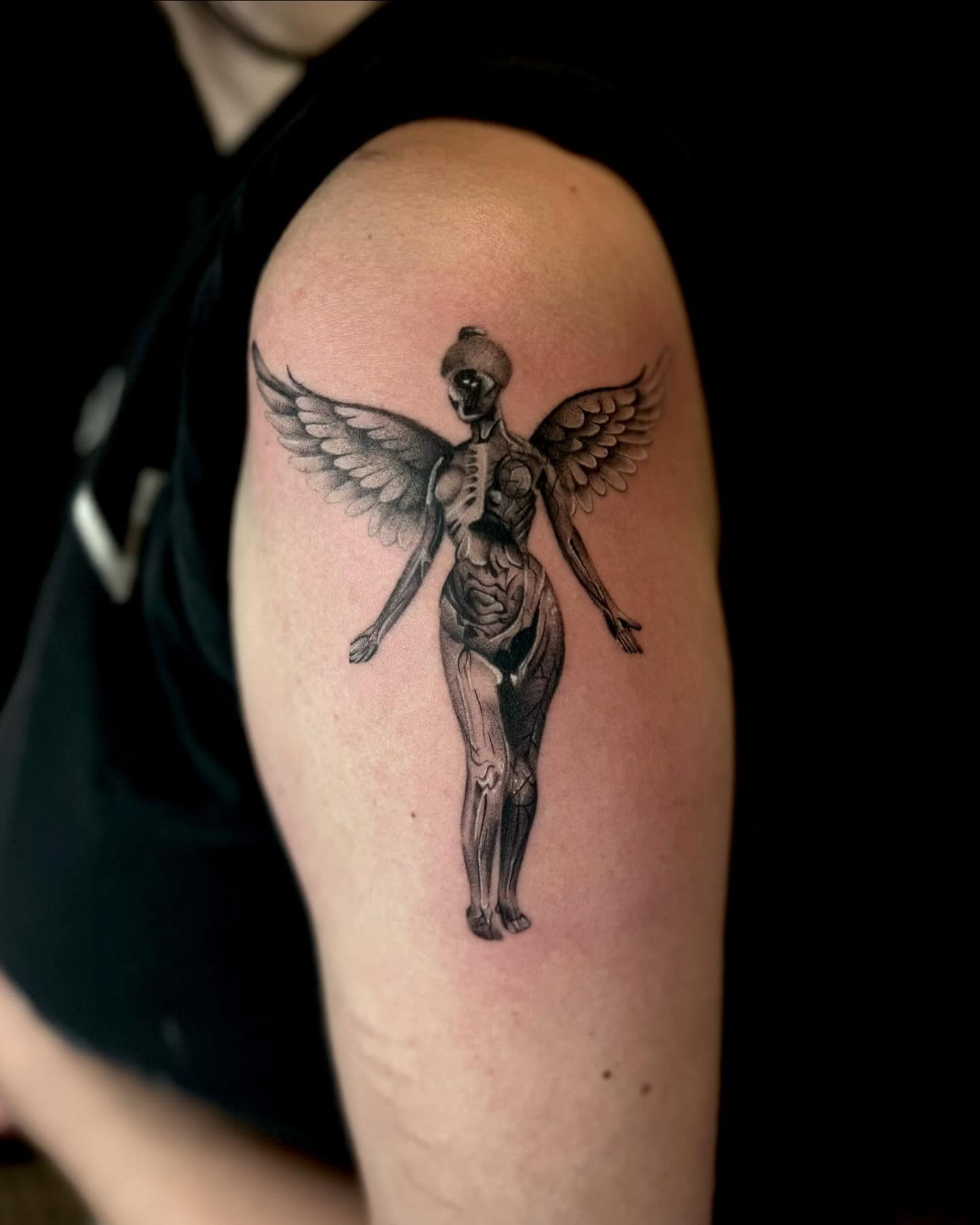 Winged skeleton realism tattoo on the shoulder by Isabel Smith🦋🕷️
