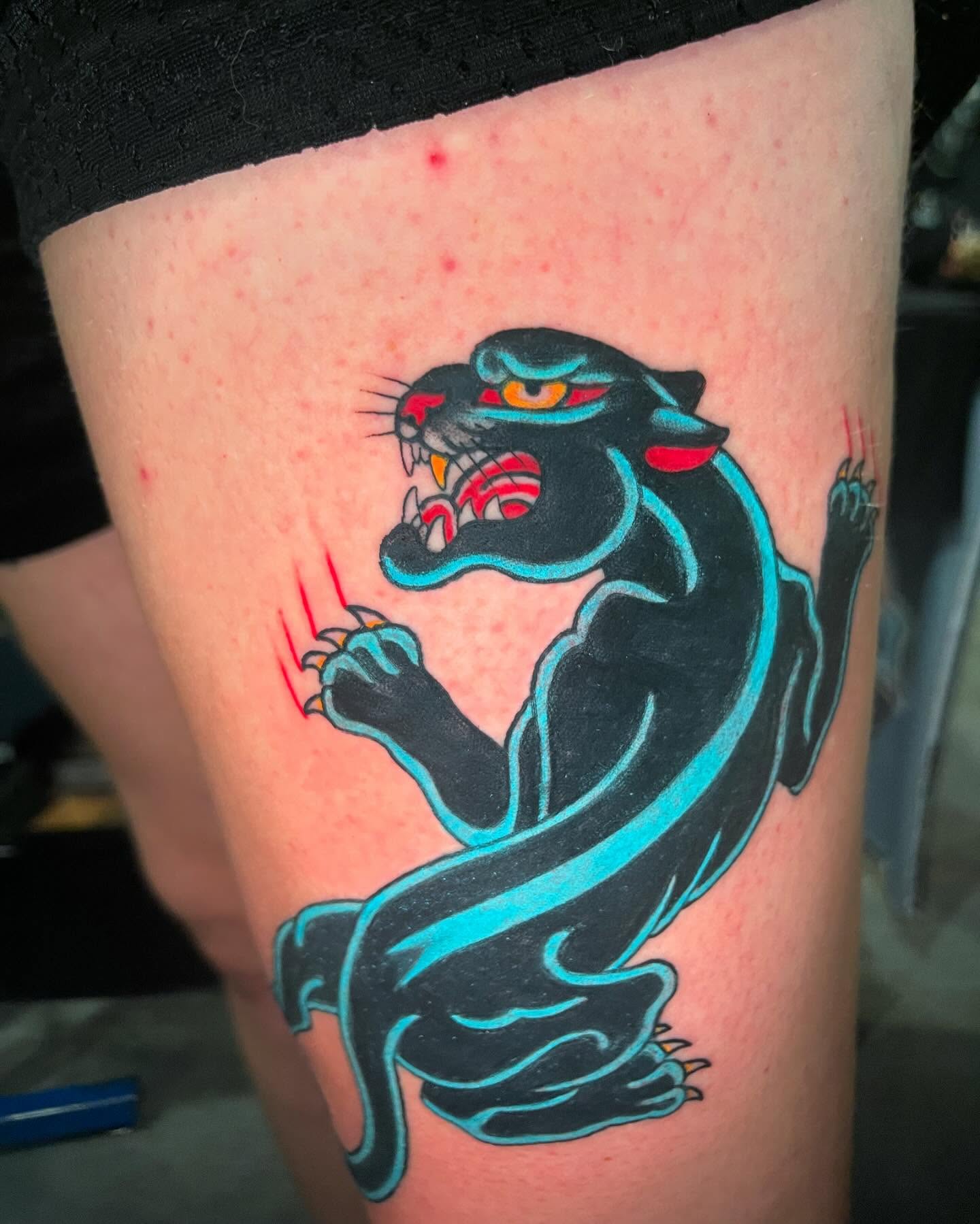 Panther American traditional tattoo on the thigh by Holli Marie