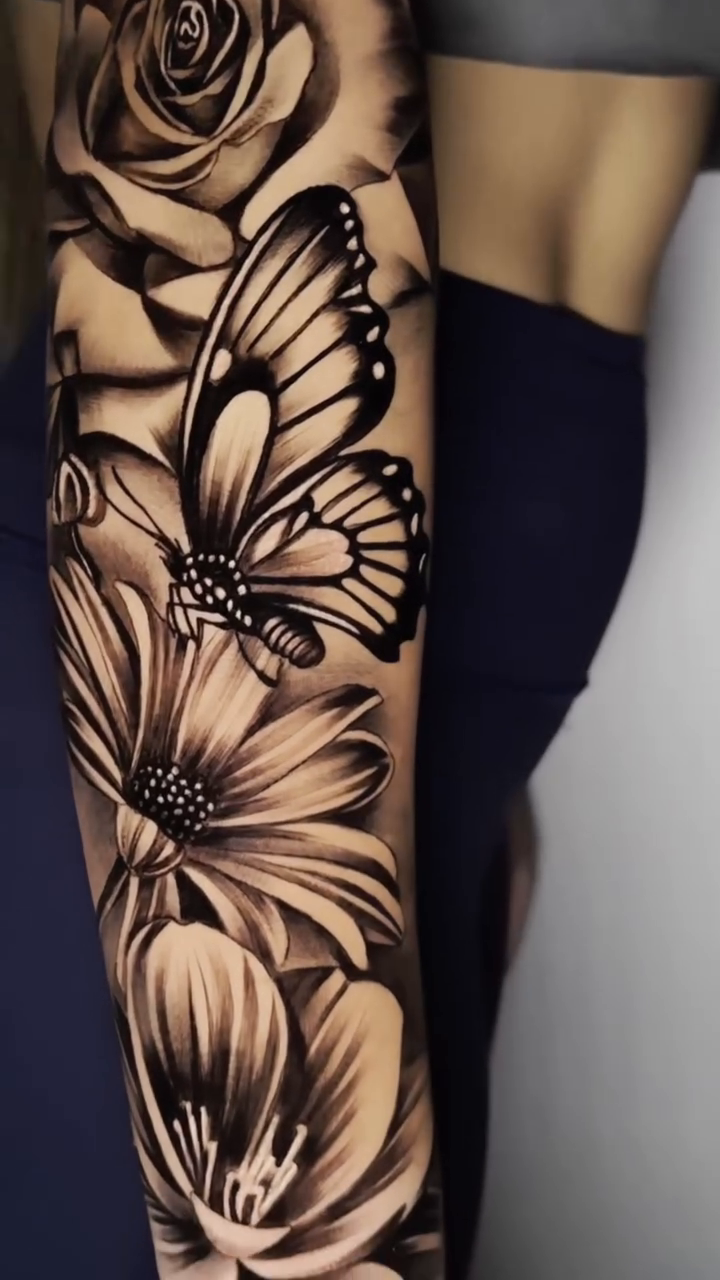 Flowers and butterfly sleeve realism tattoo by Ryan Jenkins, Las Vegas, Nevada