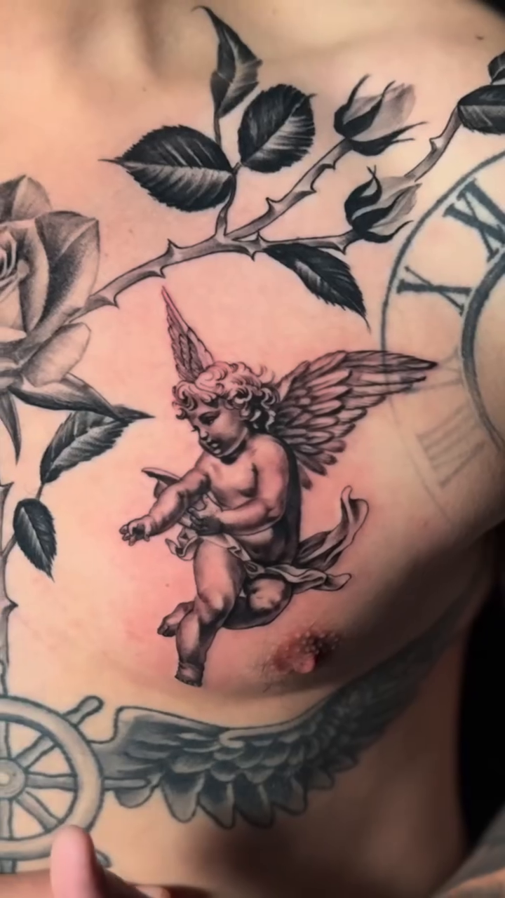 Cherub with bow and arrow realism tattoo by Brayan Molina