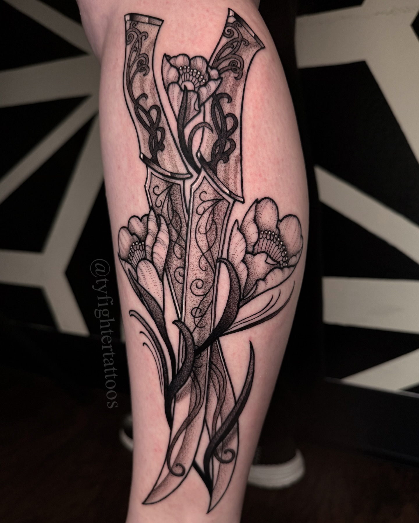 Floral arrangement dotwork tattoo on the calf by Ty engler, Northglenn, Colorado