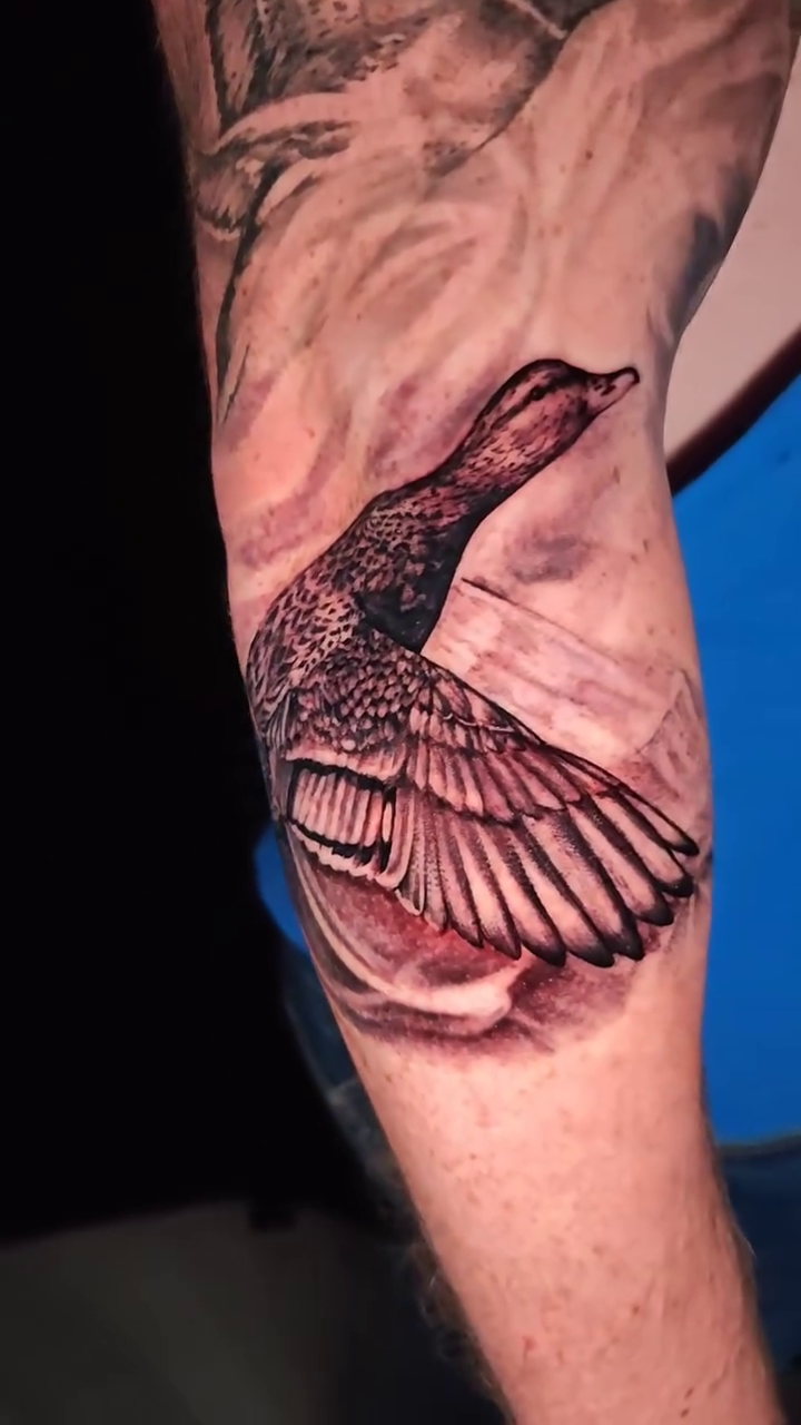 Duck in flight realism tattoo by Dallas Tattoo Artist Erik Espinoza