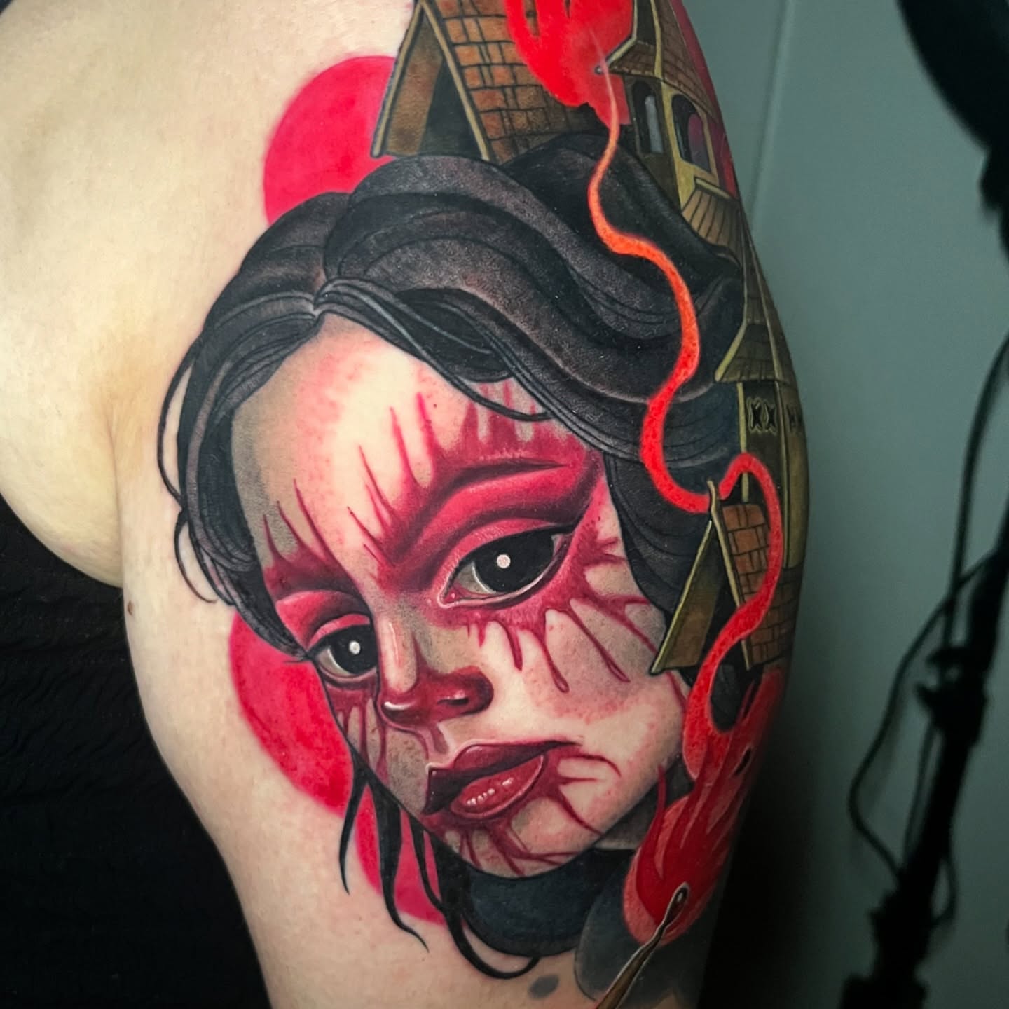 Horror doll American traditional tattoo on the forearm by Jessica Brown