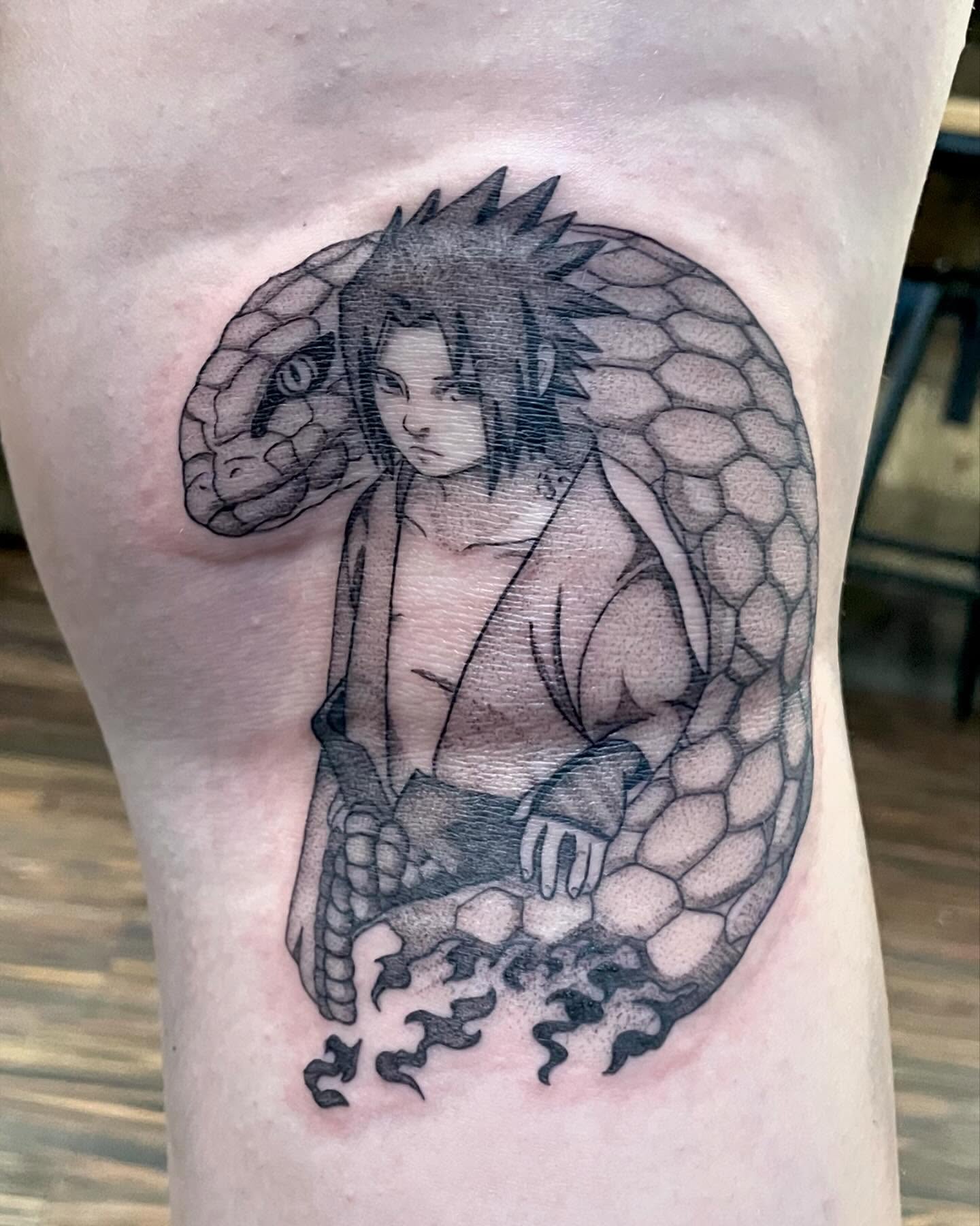 Snake and man realism tattoo on the thigh by Katie Stacy