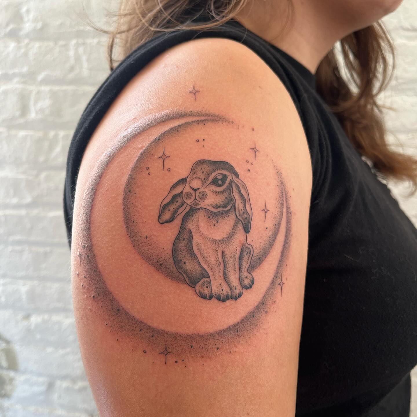 Bunny in moon dotwork tattoo on the shoulder by 𝔇𝔢𝔰𝔦