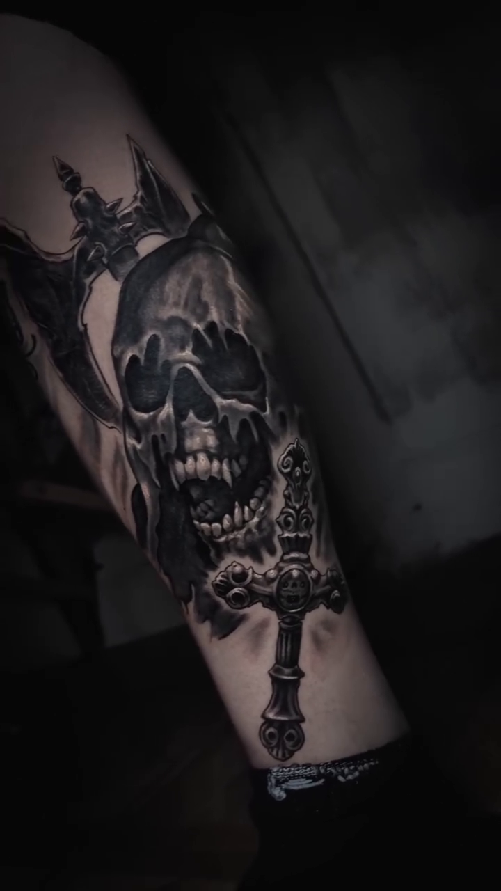 Skull with sword dark realism tattoo by Miami Florida Tattoo Artist