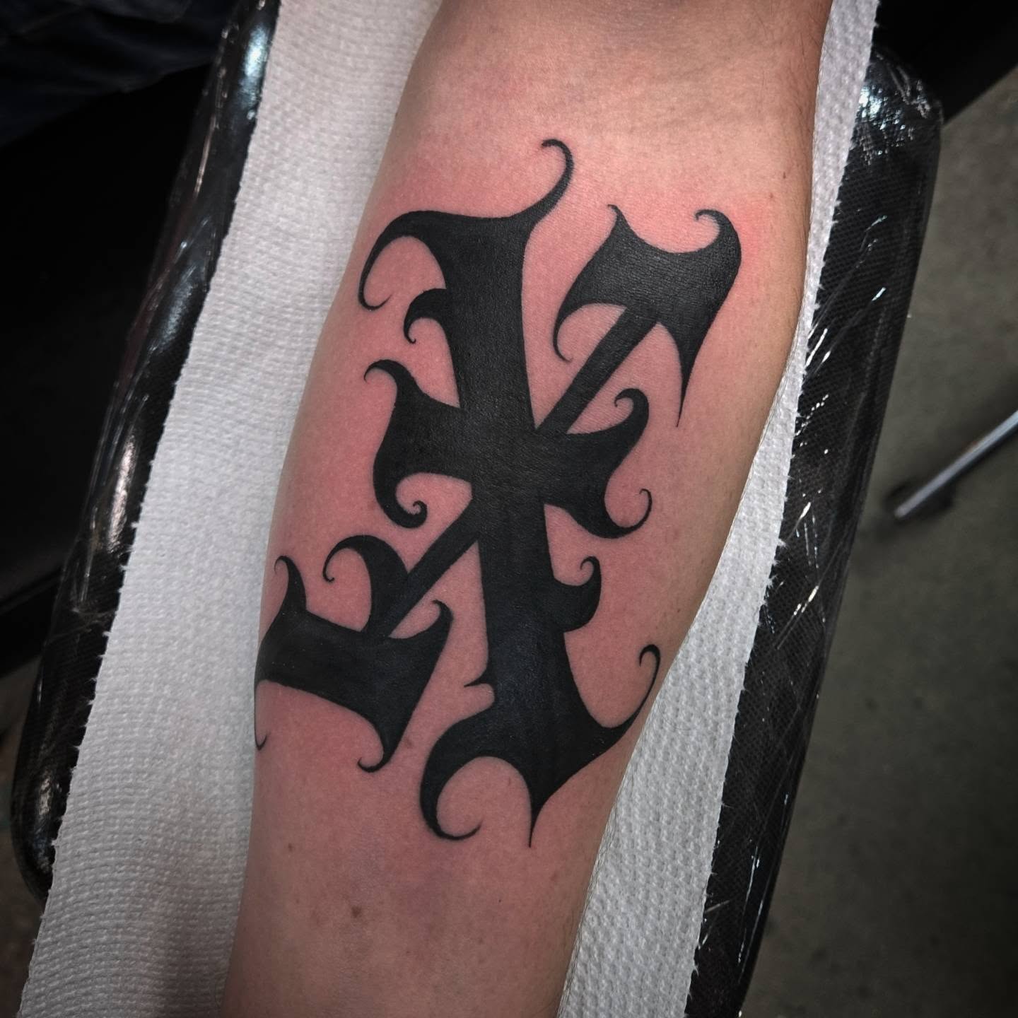 Cross black and grey tattoo on the forearm by DiazTattoos, Denver, Colorado