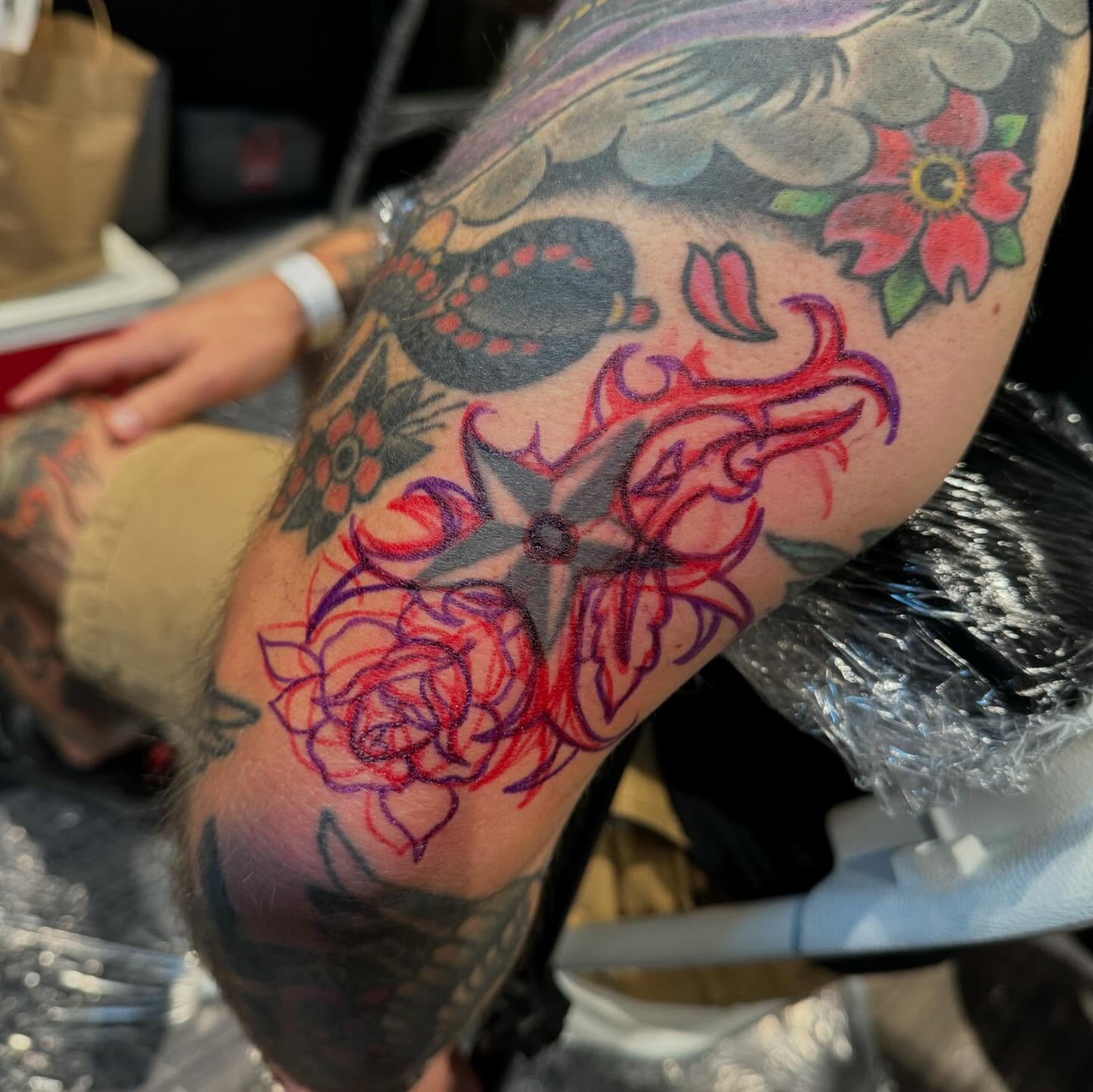Flower and cross American traditional tattoo on the forearm by Troy Mort, Altoona, Pennsylvania