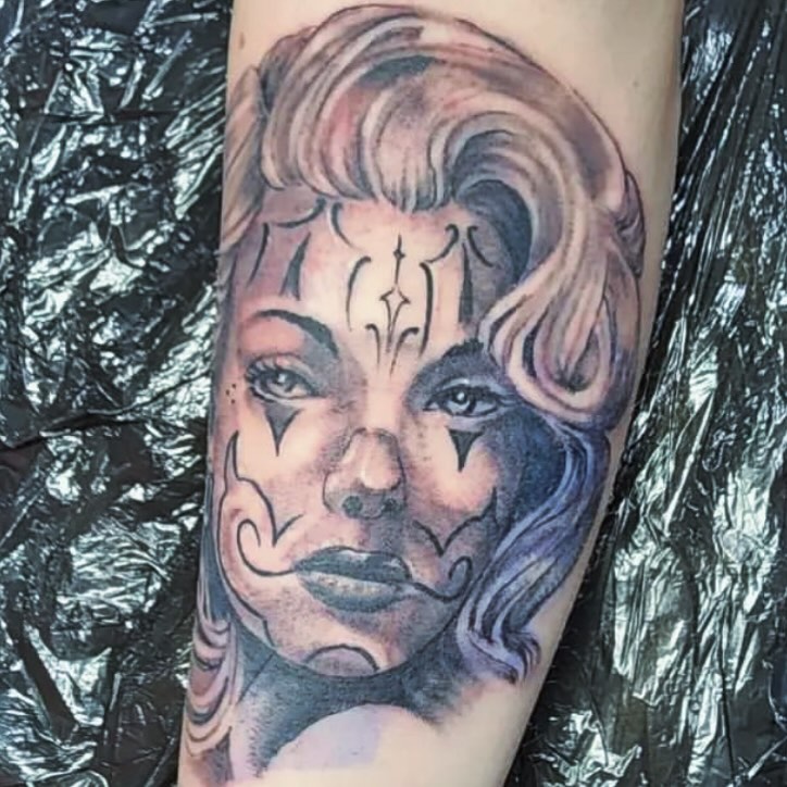 Portrait realism tattoo on the forearm by Joe Garcia