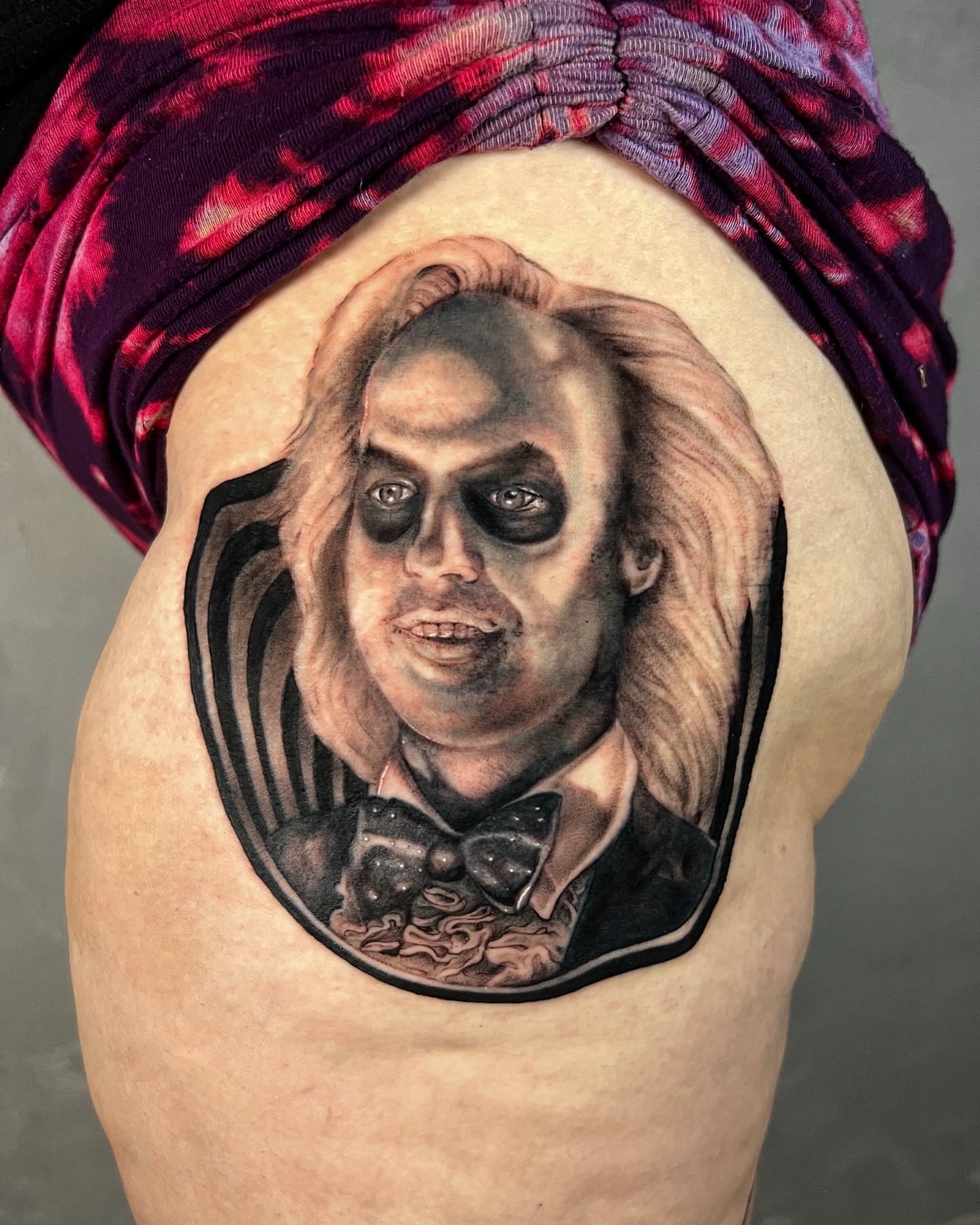 Beetlejuice realism tattoo on the shoulder by Milk Tattoos 🇸🇻🇪🇸