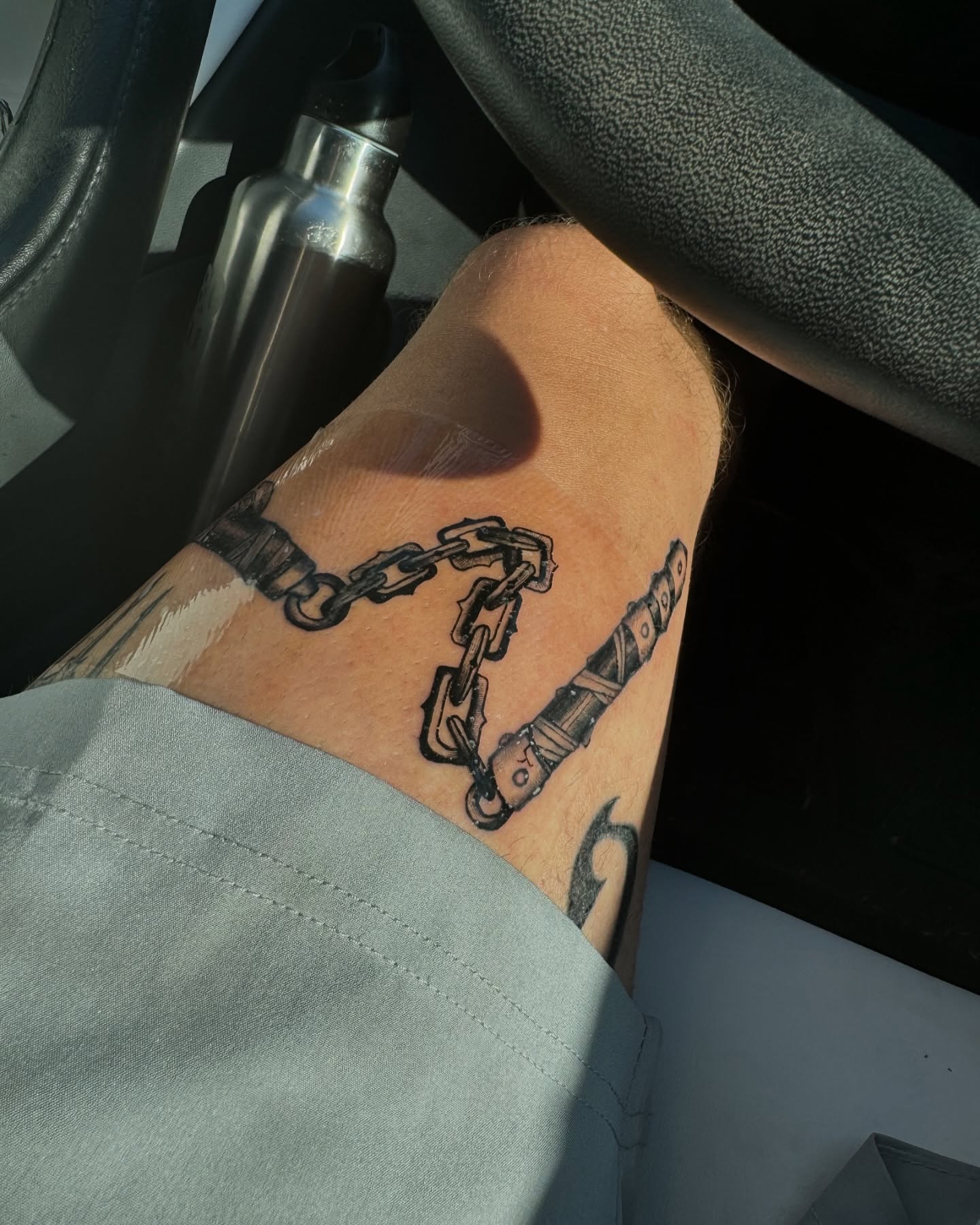 Chains and handcuffs black and grey tattoo on the forearm by Tattoo Artist ⚔️ San Diego, CA