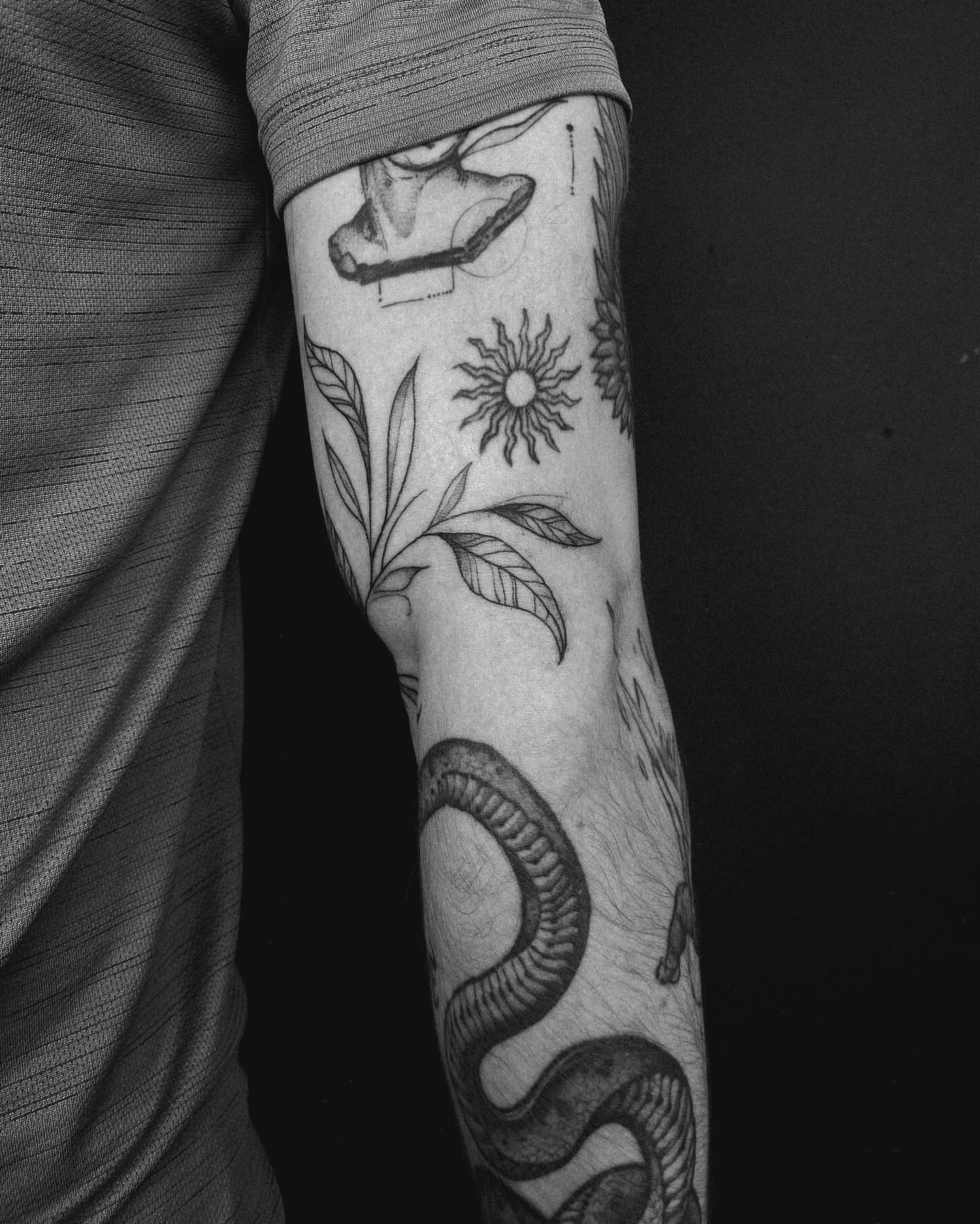 Tattoo by @chrisdafacetattoo — fine_line, black_and_grey