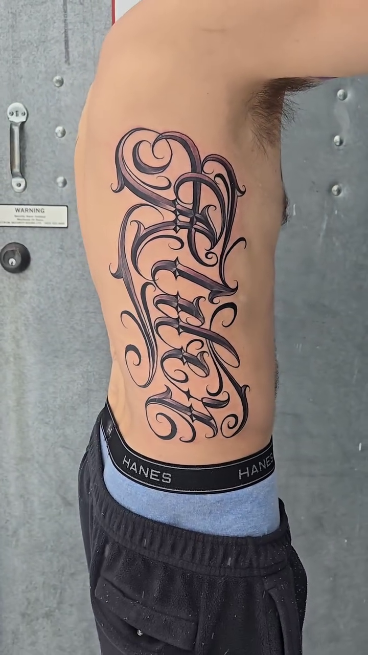 Family lettering script tattoo by mr.scriptkeeper