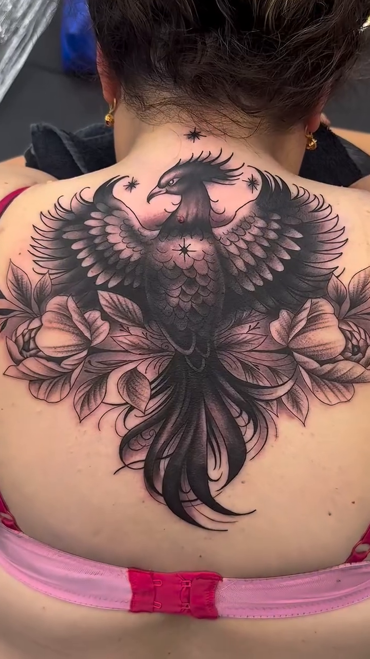 Phoenix with flowers realism tattoo by Michael Sosa