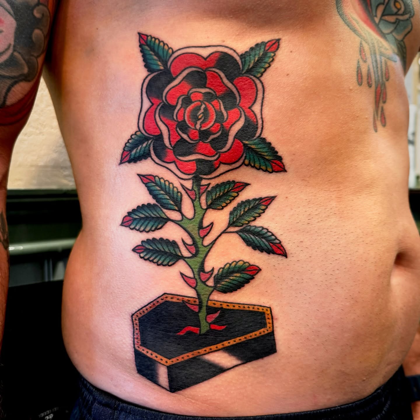 Rose American traditional tattoo on the ribs by Pavel