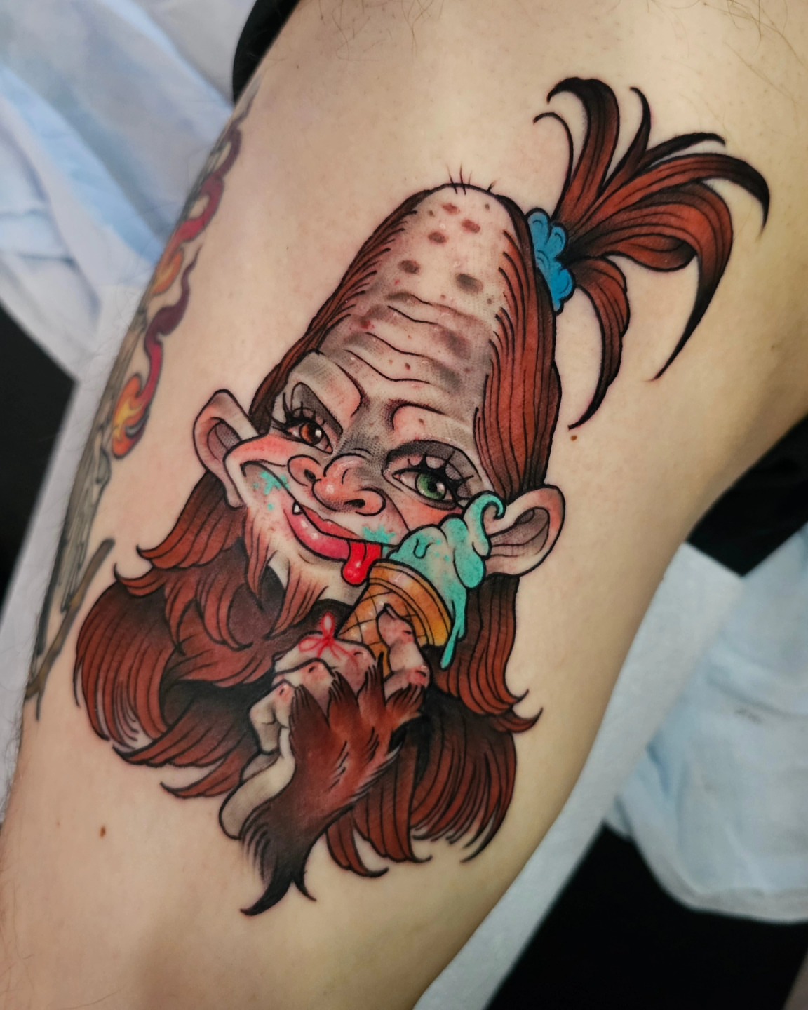Clown eating ice cream American traditional tattoo on the thigh by Shannon
