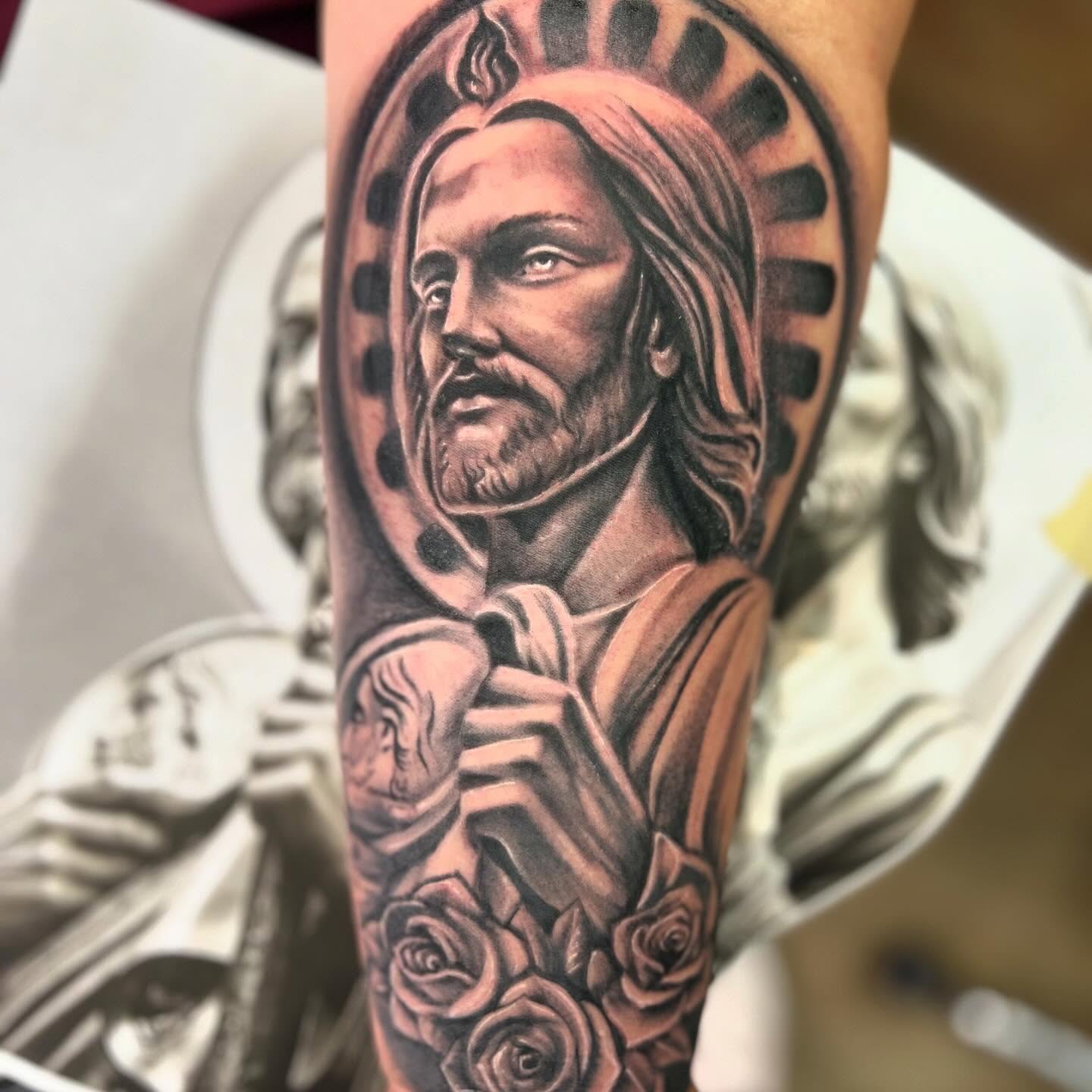 Religious figure realism tattoo on the forearm by Summer Rain