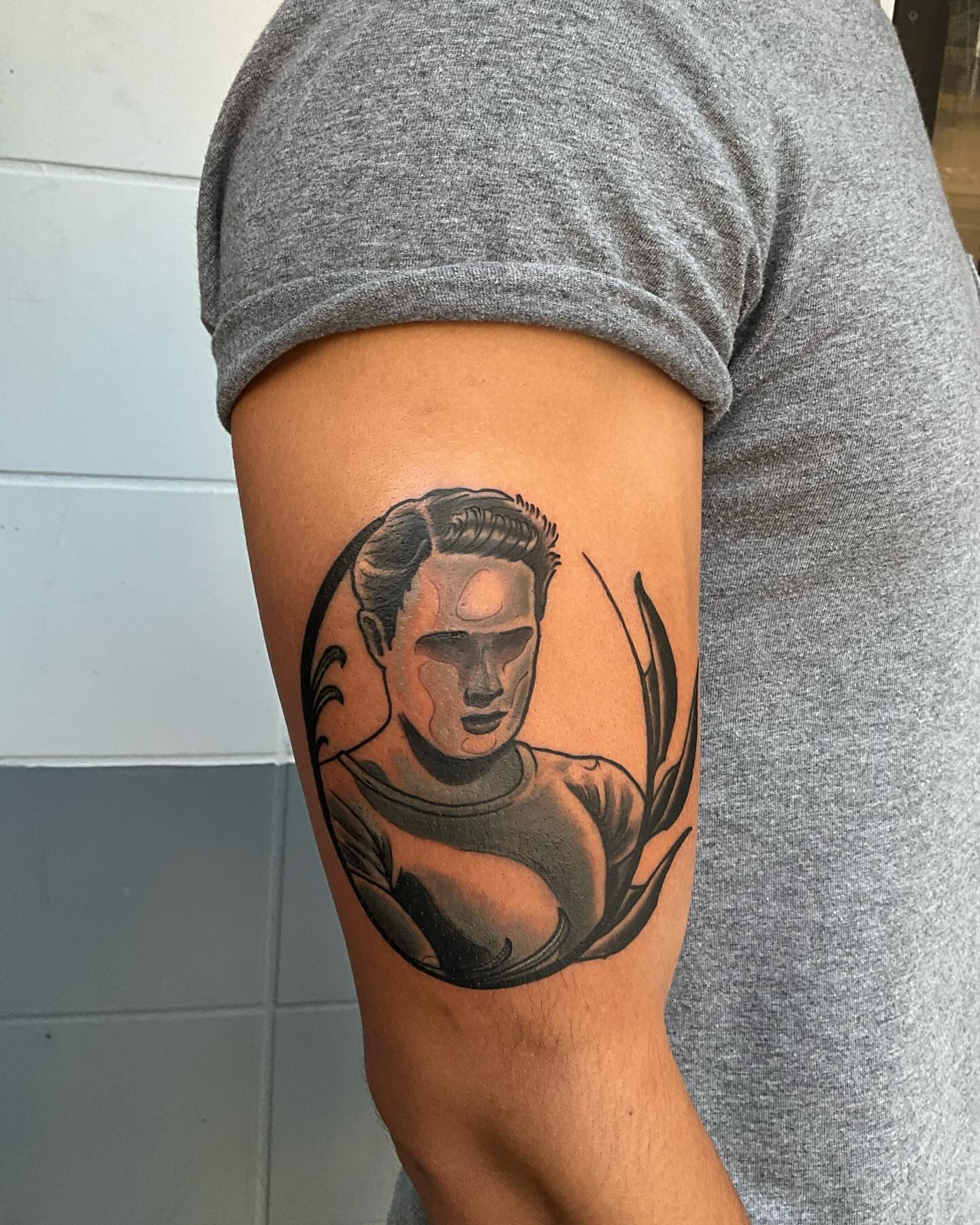 Man black and grey tattoo on the forearm by J. Arturo Laparra