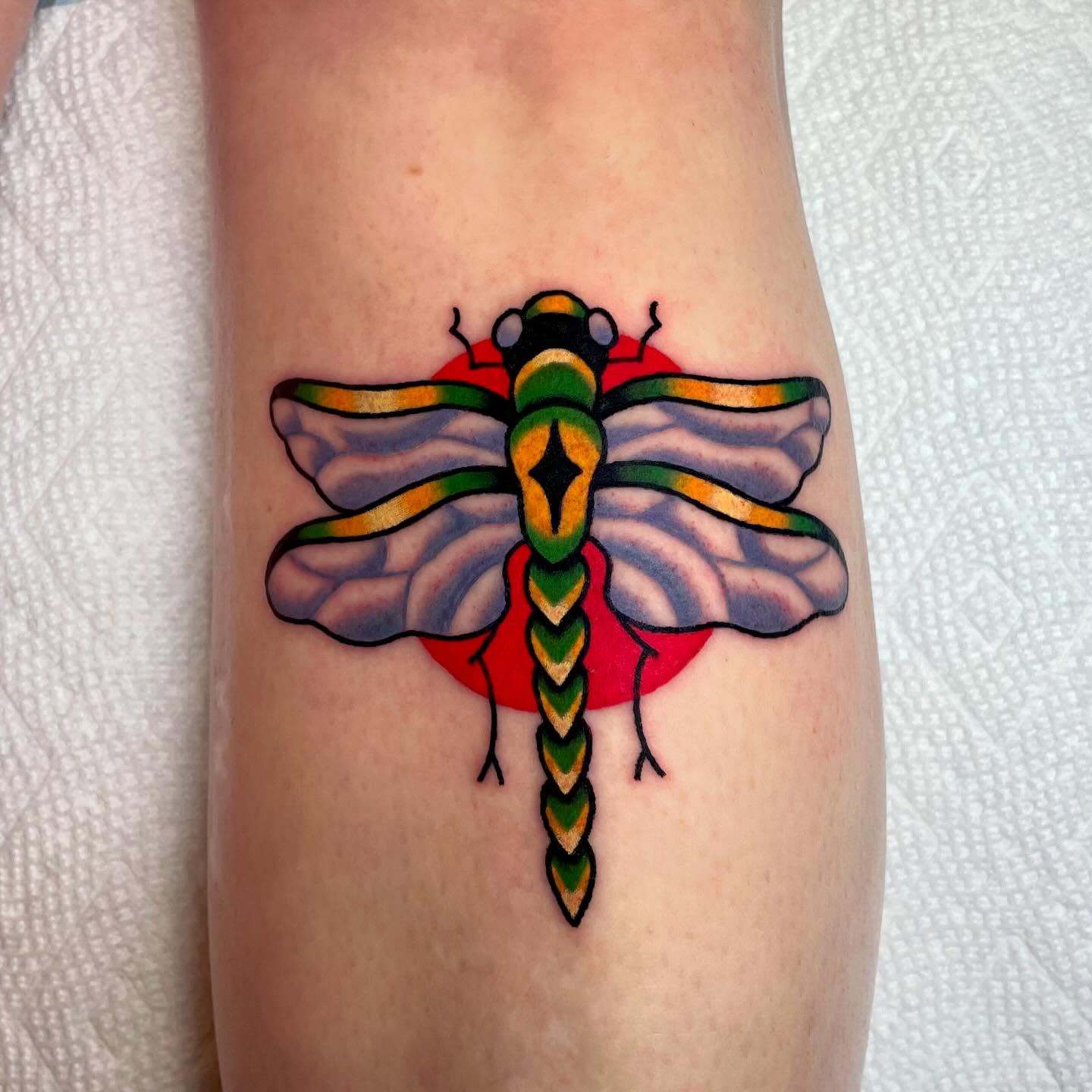 Dragonfly American traditional tattoo on the forearm by Nova Vaughn