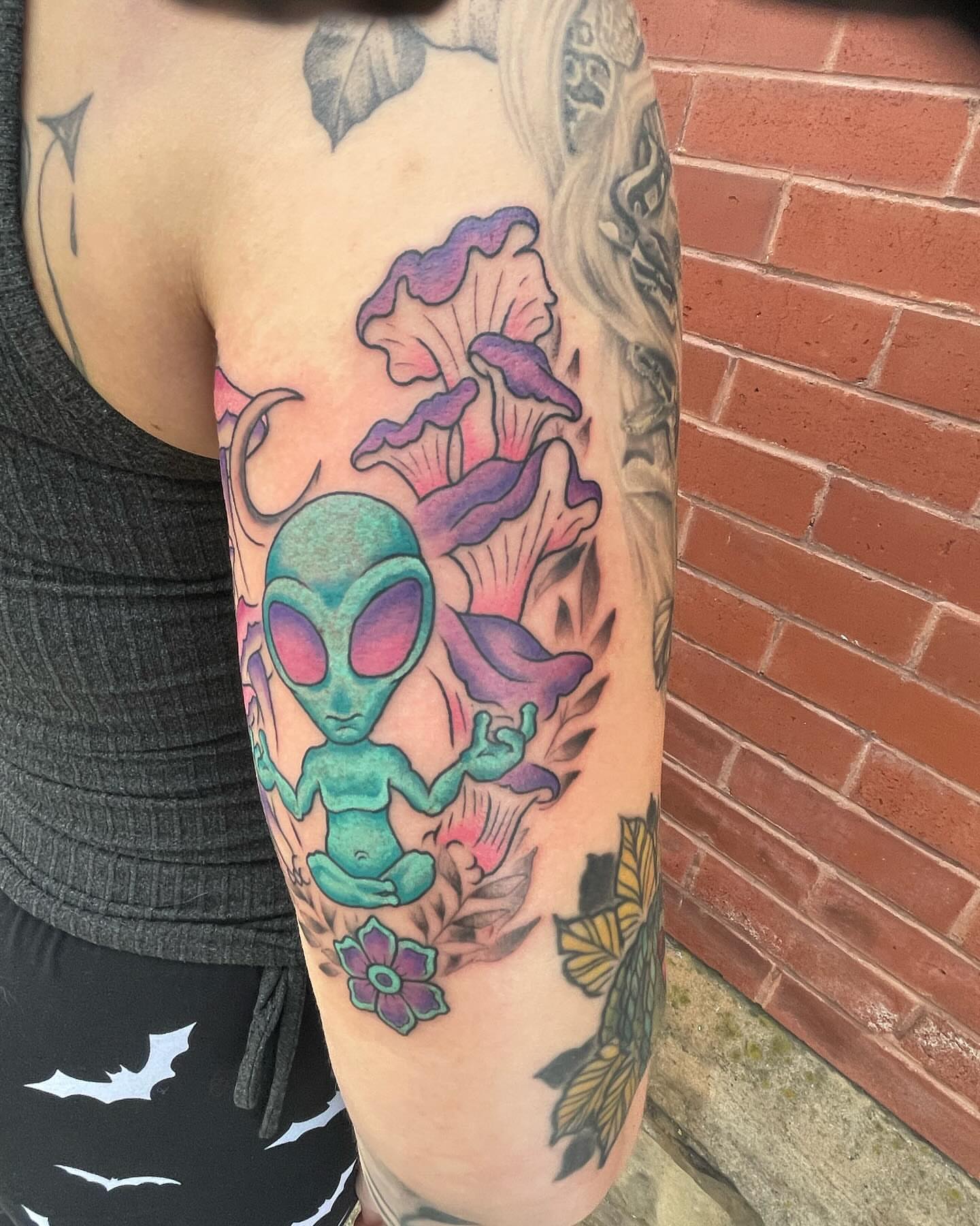 Alien meditating new school tattoo on the forearm by Auzzy the Ink Pirate, Mansfield, Ohio
