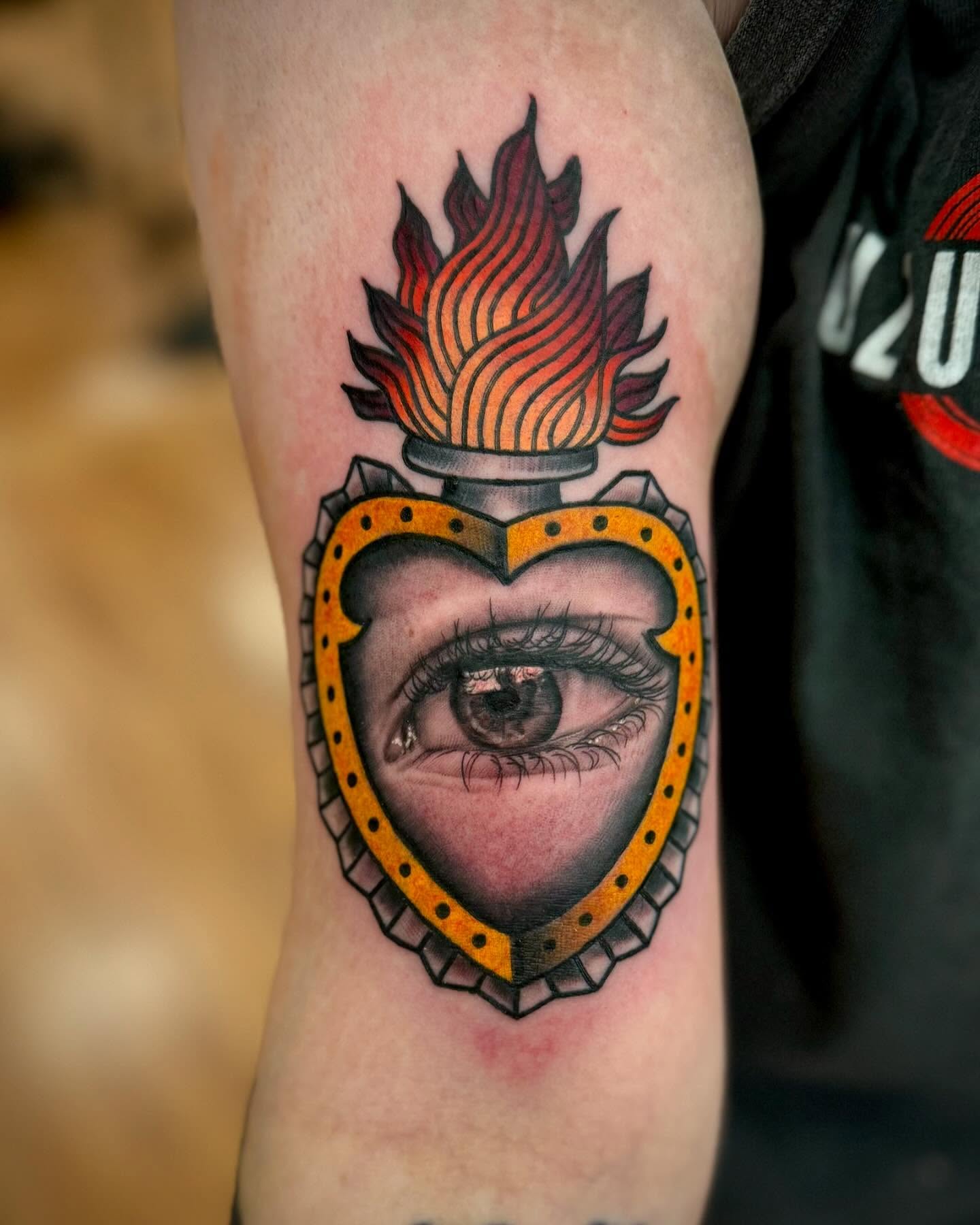 Eye with flame American traditional tattoo on the forearm by Sam Babcock