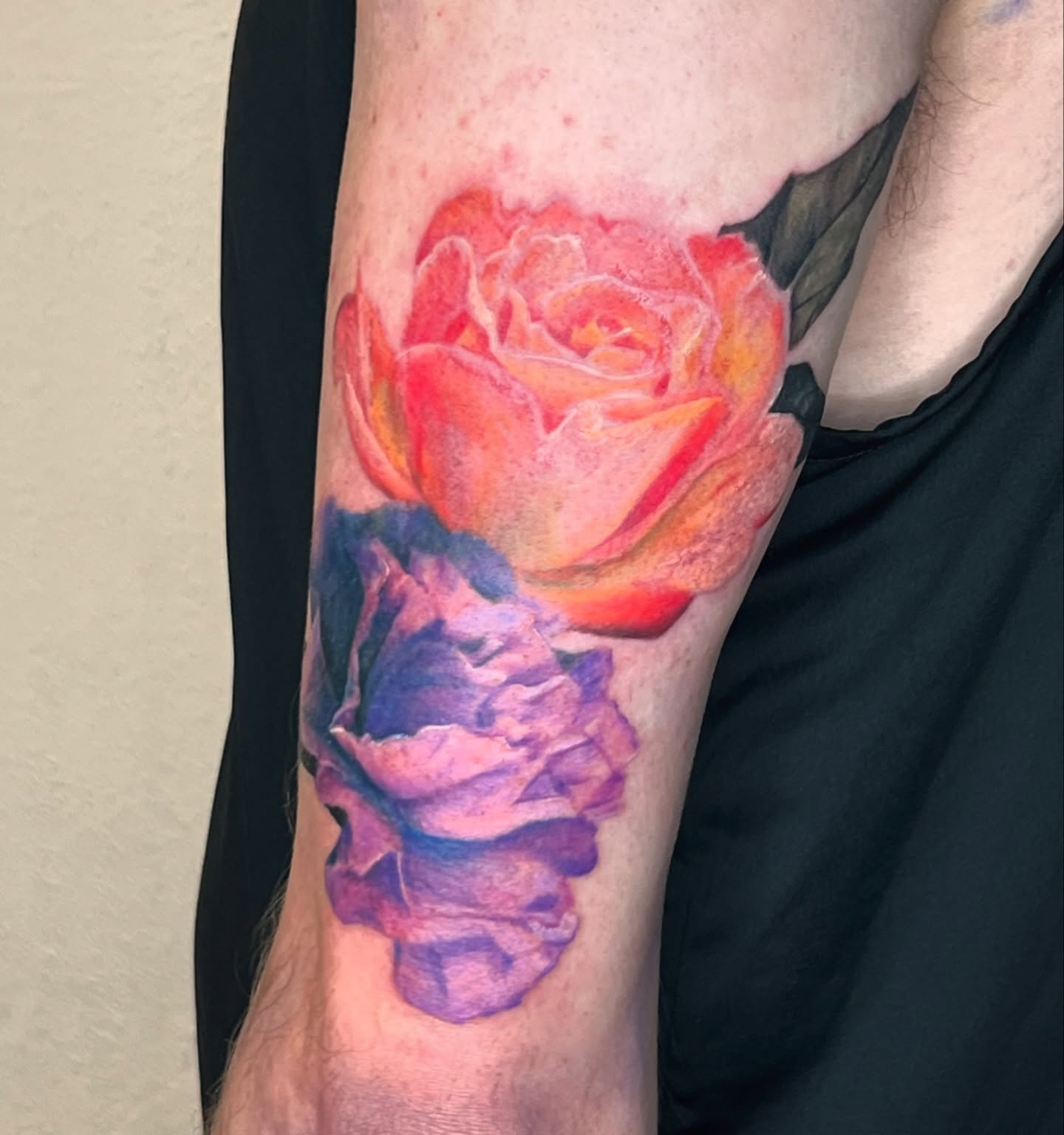 Roses watercolor tattoo on the forearm by Jordan