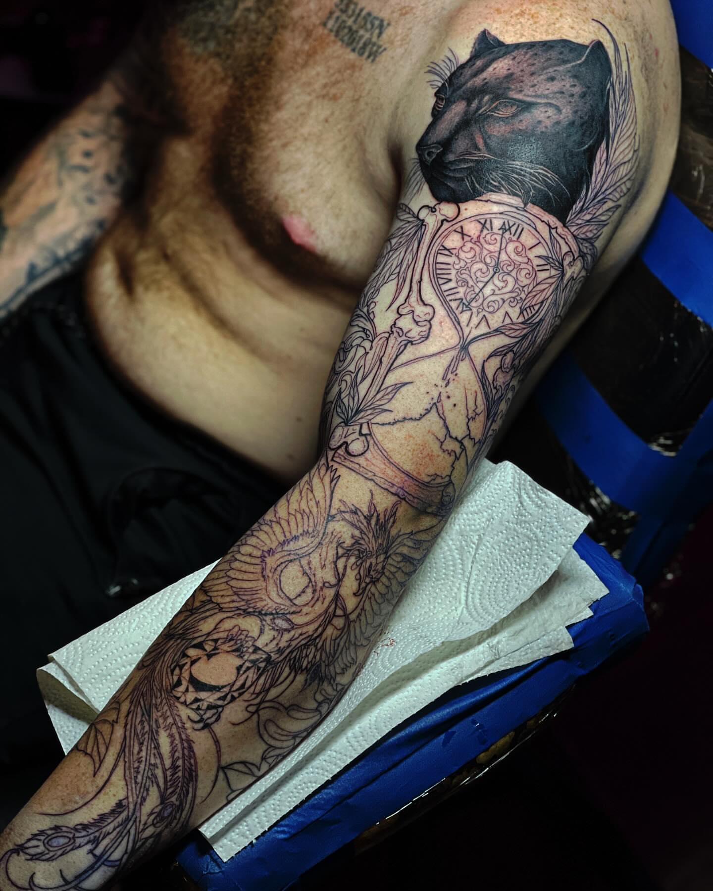 Panther and clock black and grey tattoo on the forearm by Jamie Jane Voryer