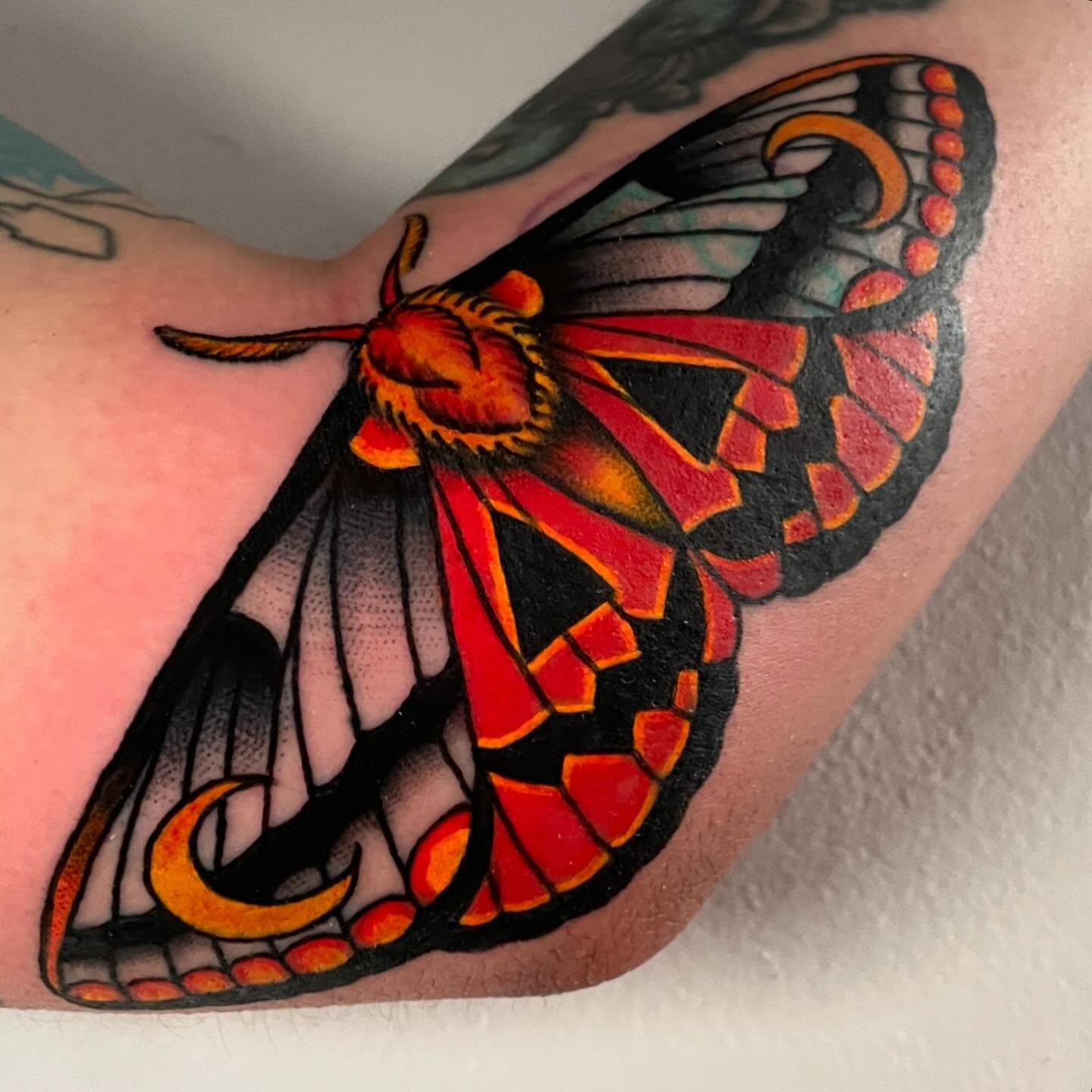 Moth American traditional tattoo on the forearm by Madison ‘Maddog’ Stewart