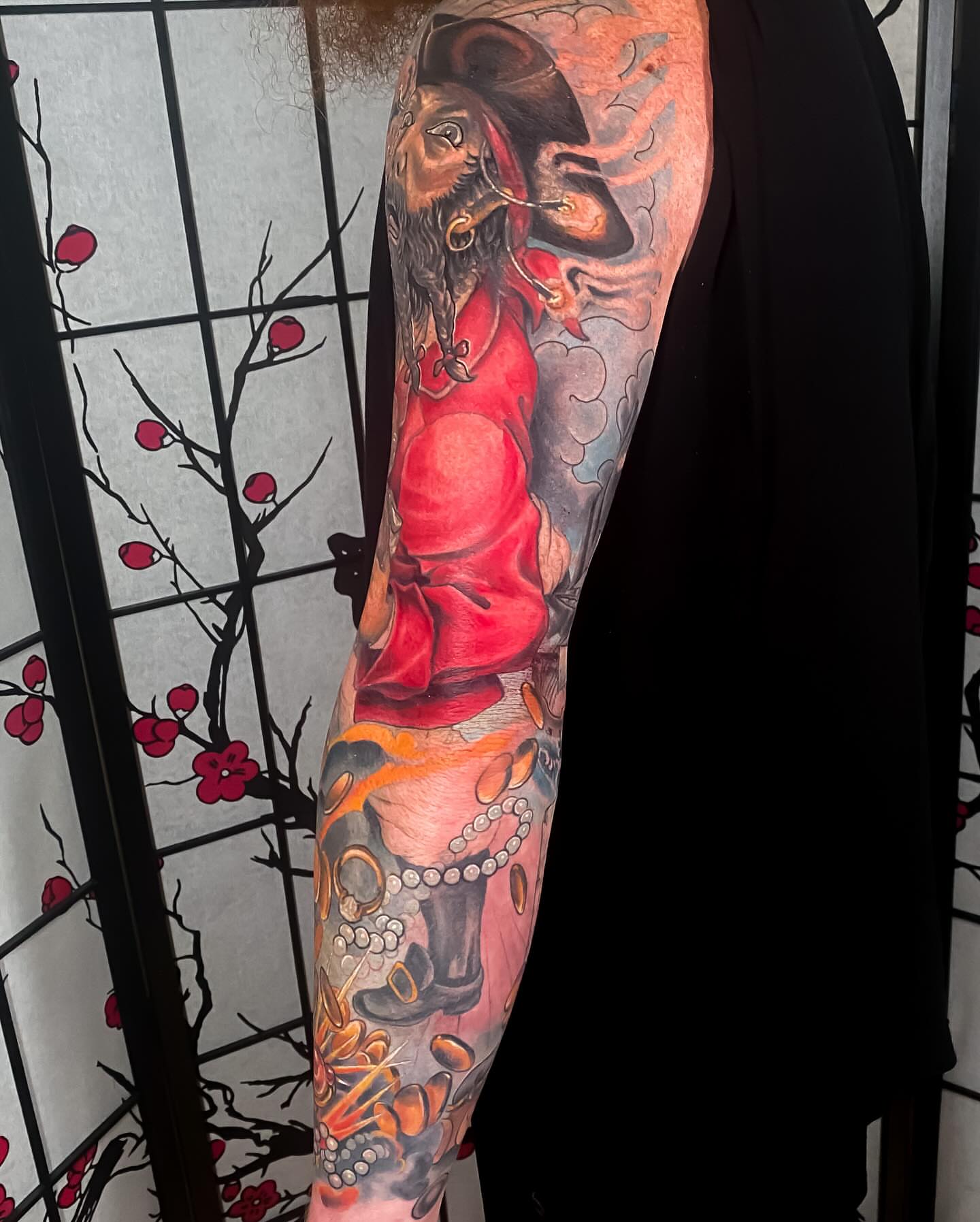 Pirate with red coat American traditional tattoo on the forearm by Eric James, Phoenix, Arizona