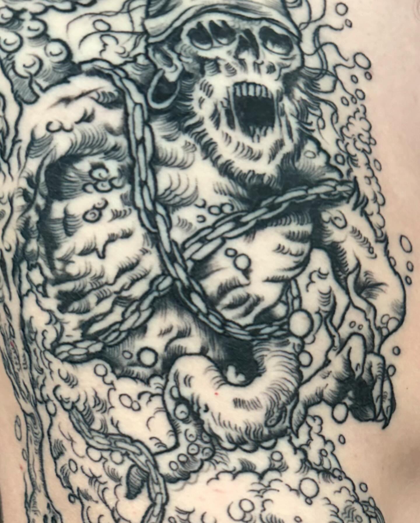 Screaming skull American traditional tattoo on the forearm by John Milosh Chamberlin