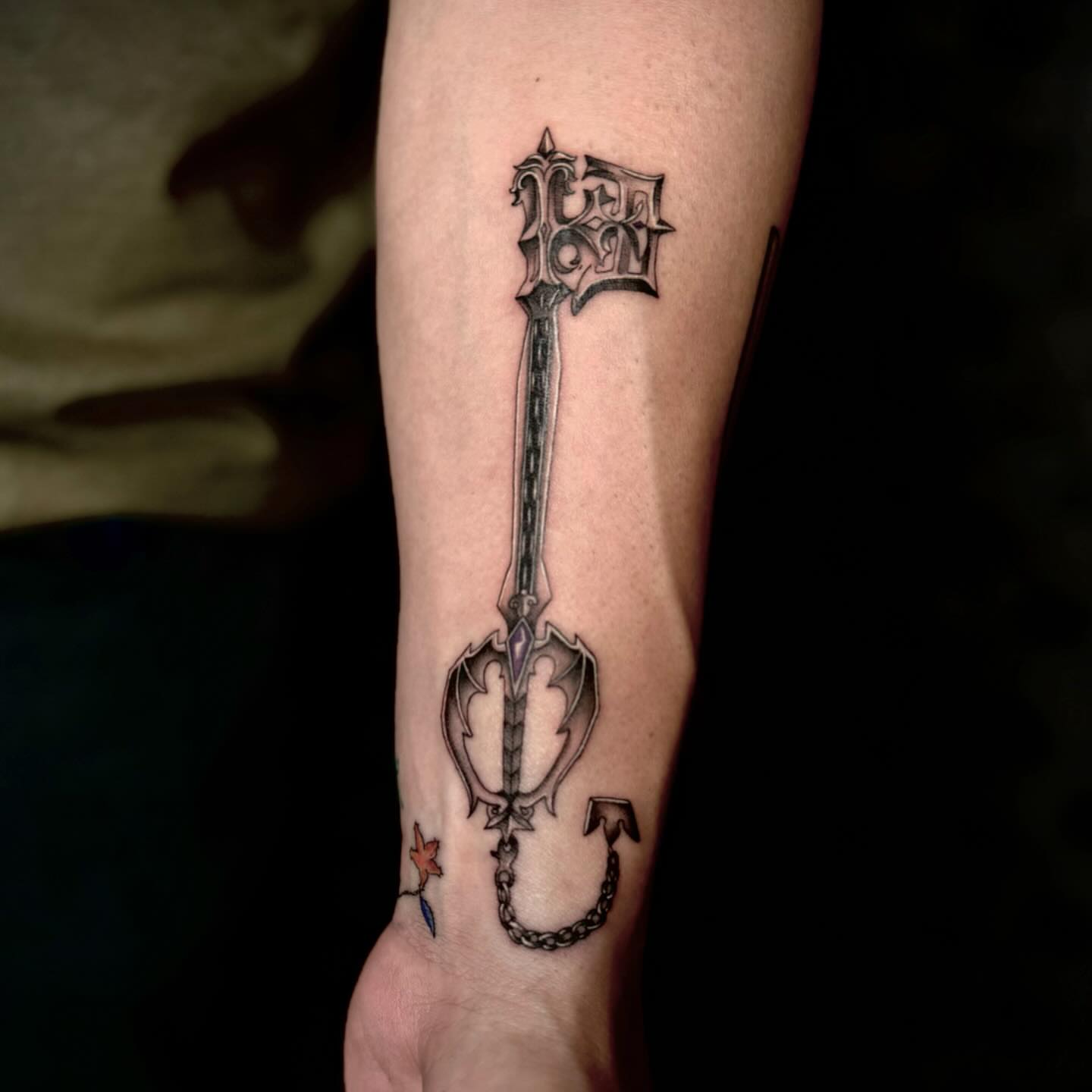 Key black and grey tattoo on the forearm by oh hey, robin.